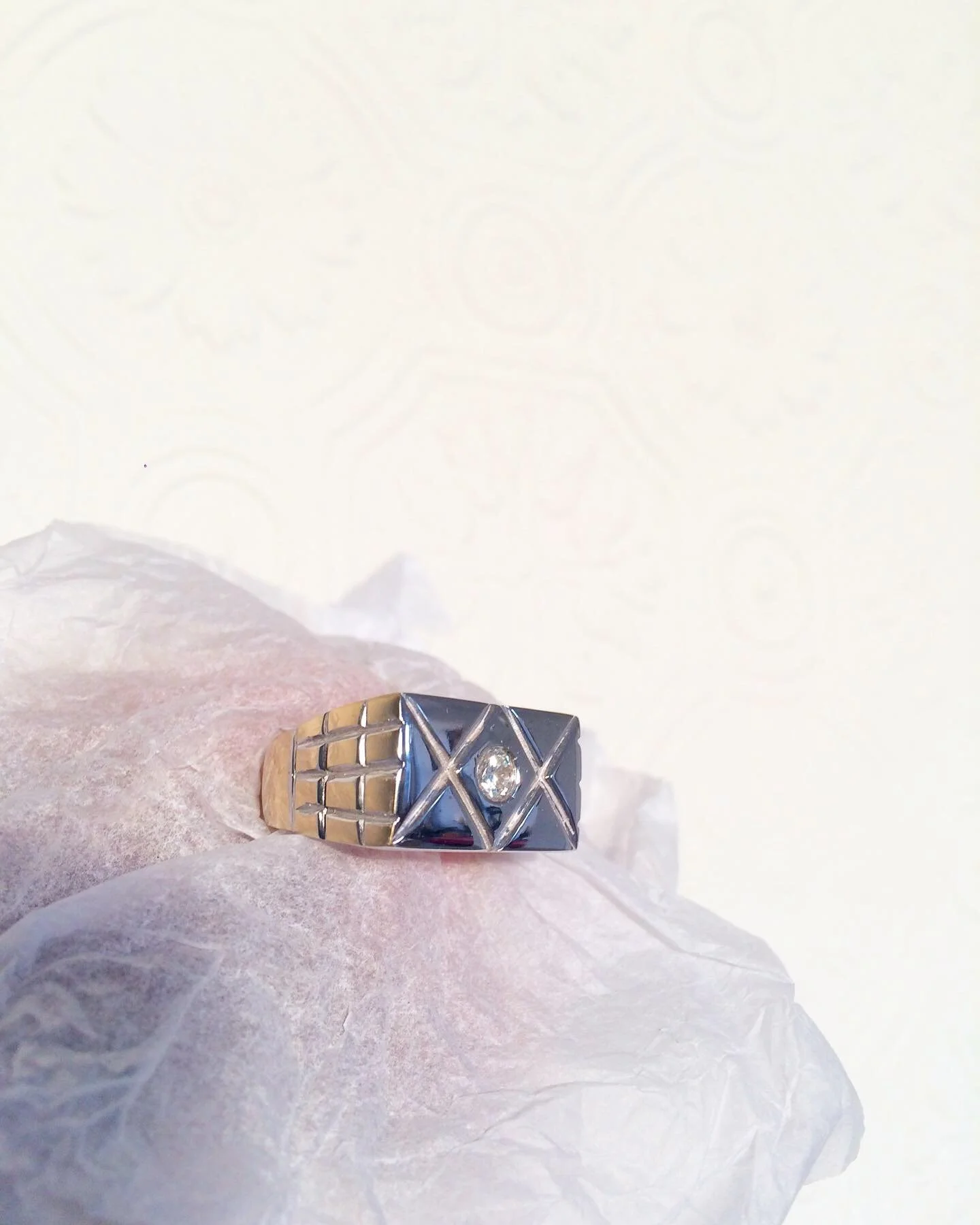A hand carved 9k mixed metal gold signet ring with topaz birthstone set at front