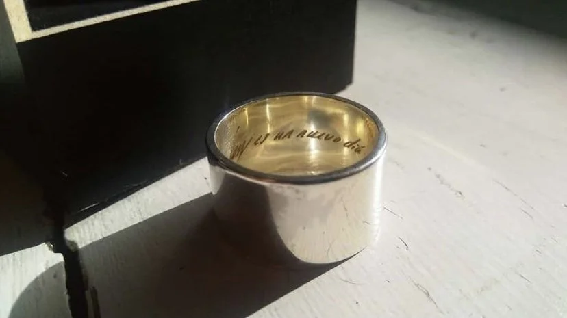 A wedding band with an internal engraving inside ring