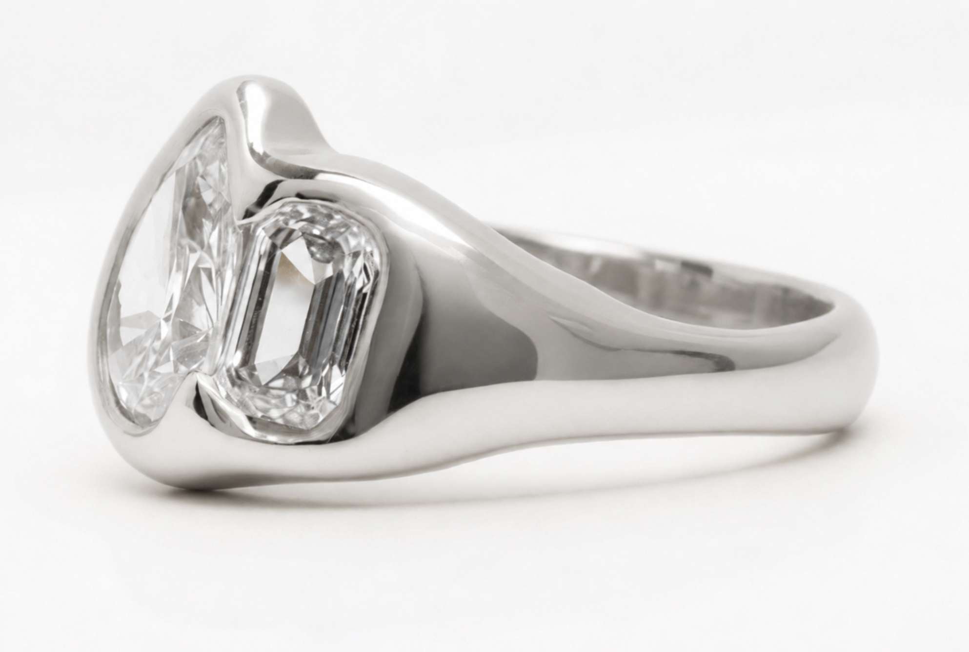 18k white gold toi et moi ring with pear-cut and emerald-cut lab-grown diamonds in organic bezel settings