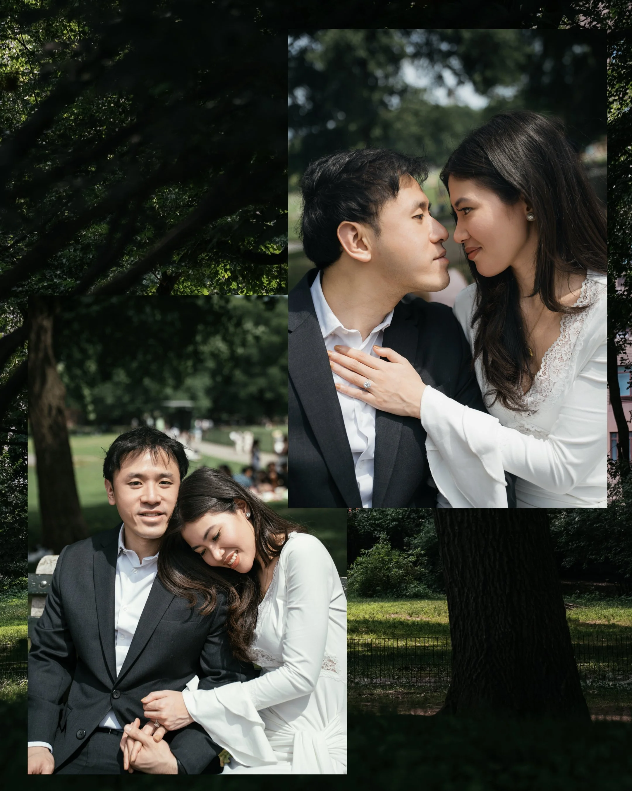A couple dressed in formal attire in a park, with trees and green grass in the background. The man has short black hair and is wearing a dark suit and white shirt. The woman has long dark hair and is wearing a white dress with lace details. They are 
