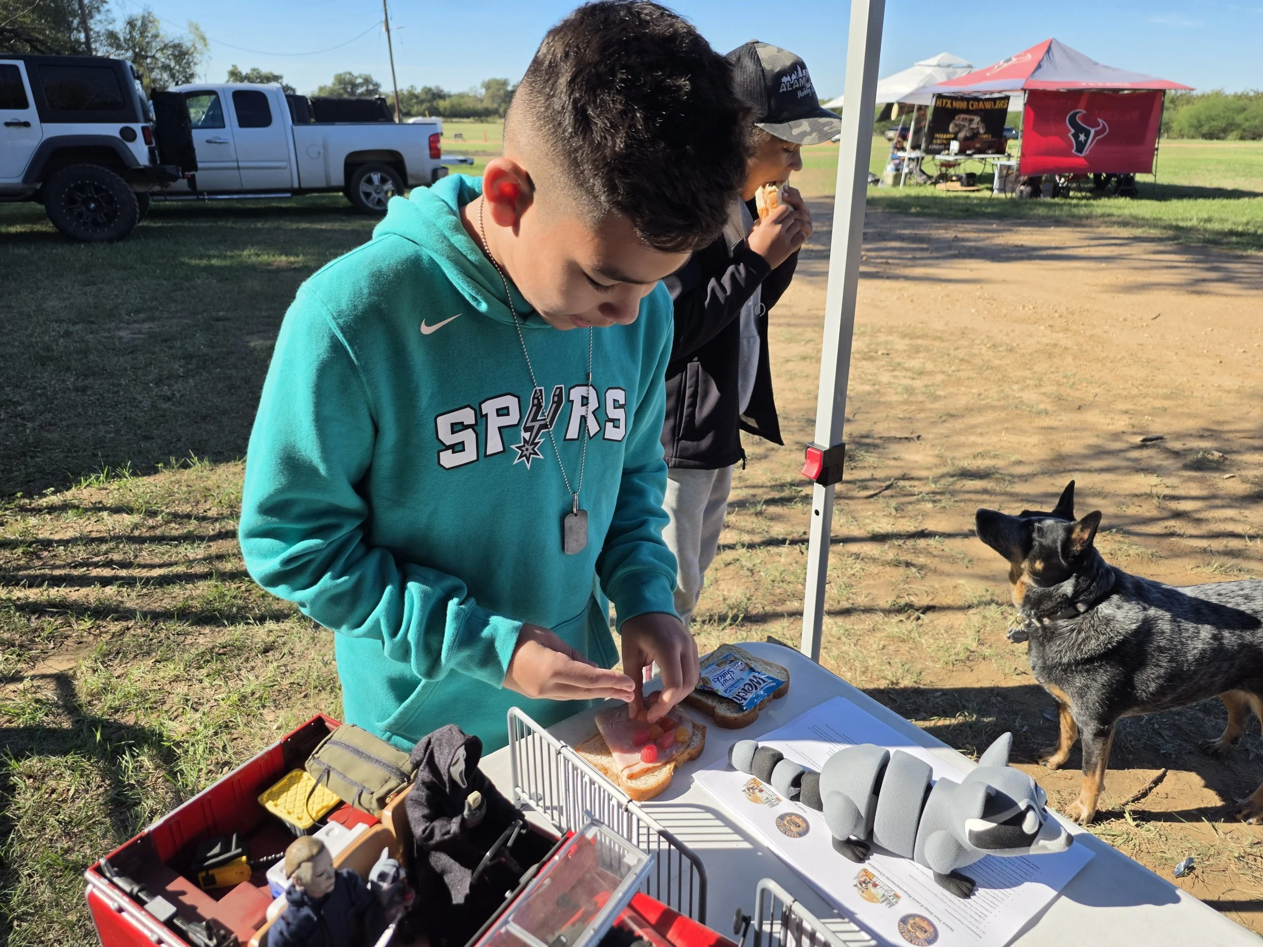 Junior Crawler prepping a sandwich with gummy snacks a the Trash Panda RC booth during Rocky Hill RC Roundup
