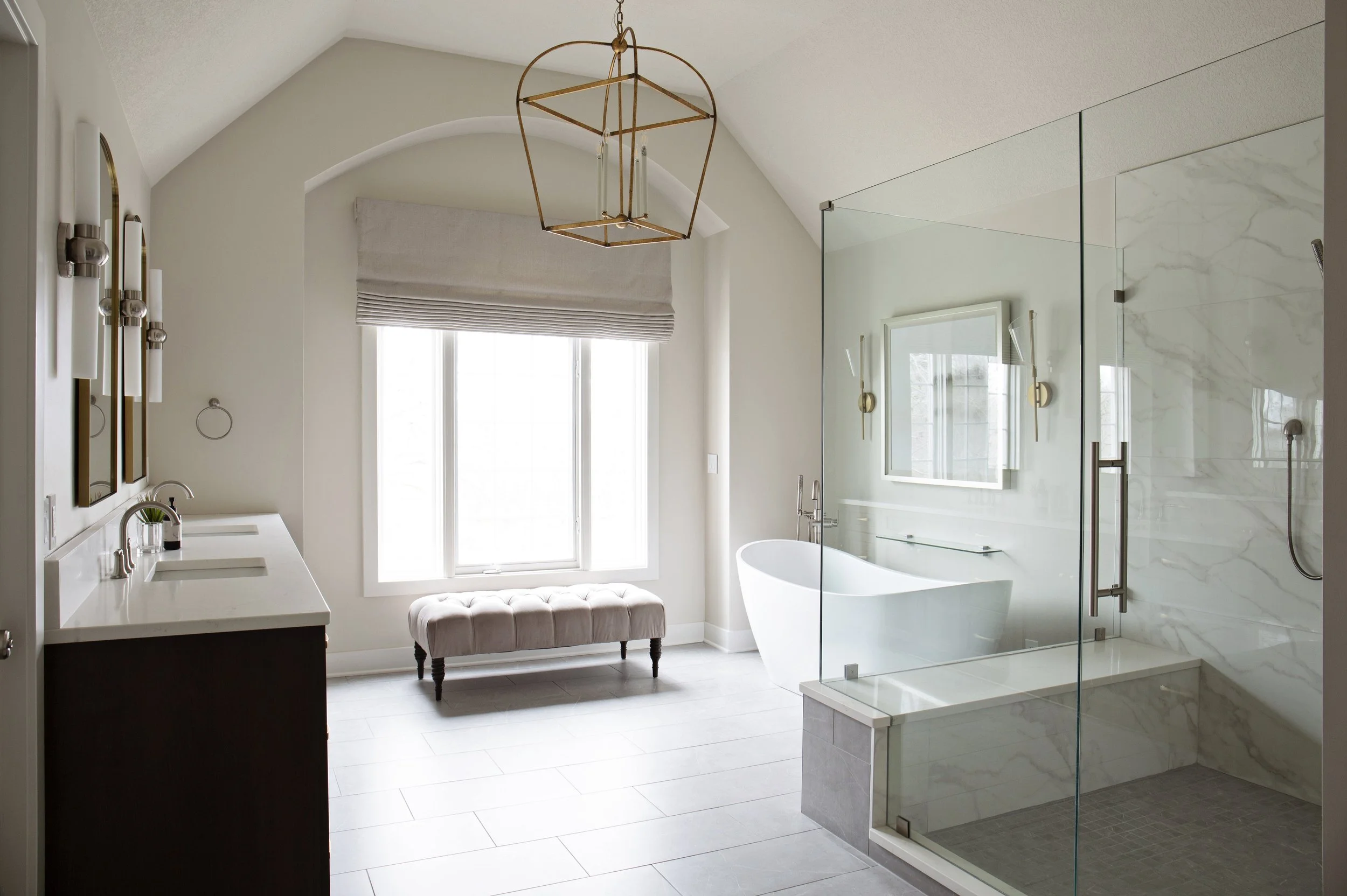Luxury primary bathroom renovation with freestanding tub, marble shower, custom double vanity, and soft neutral finishes