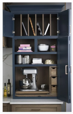 DuraSupreme custom kitchen larder cabinet with appliance storage, pantry organization, and hidden countertop workspace.