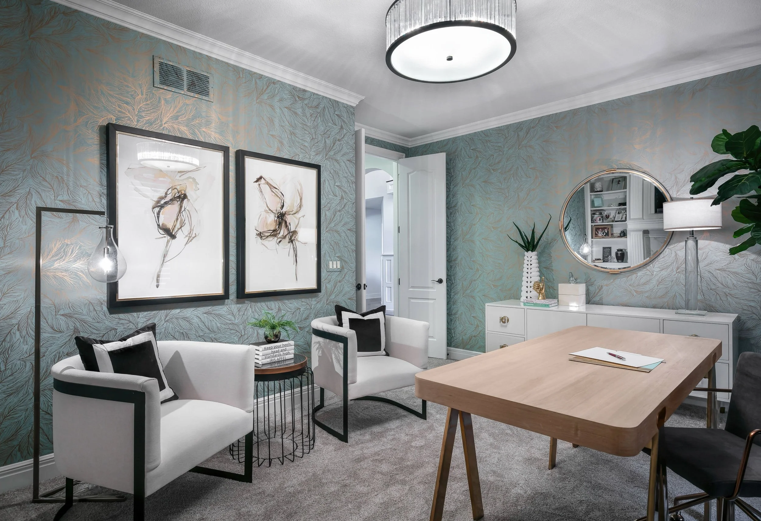 Chic home office design with textured wallpaper, refined furnishings, and warm contemporary styling