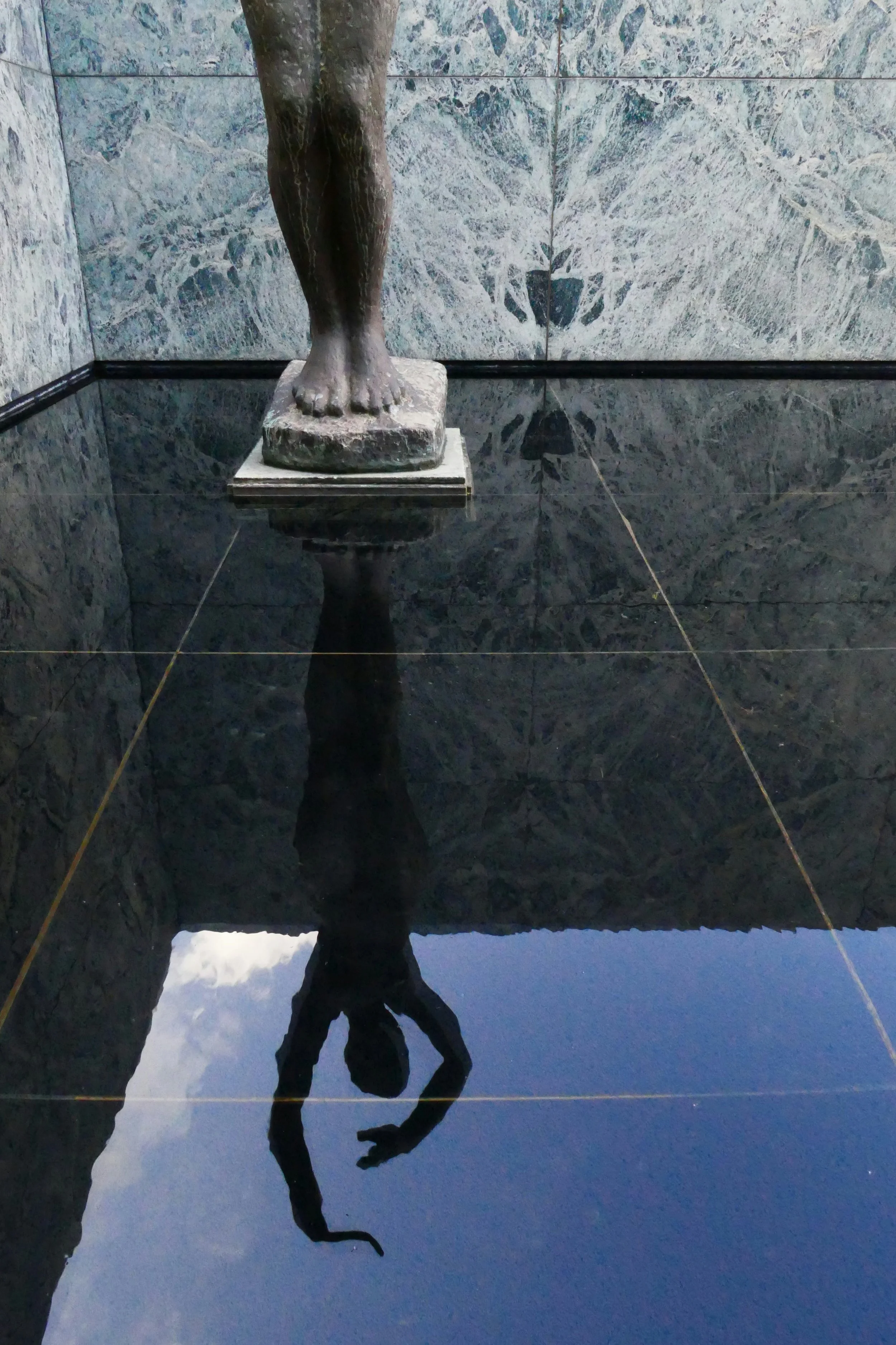 Large-Format Porcelain & Blue Stone Tiling.