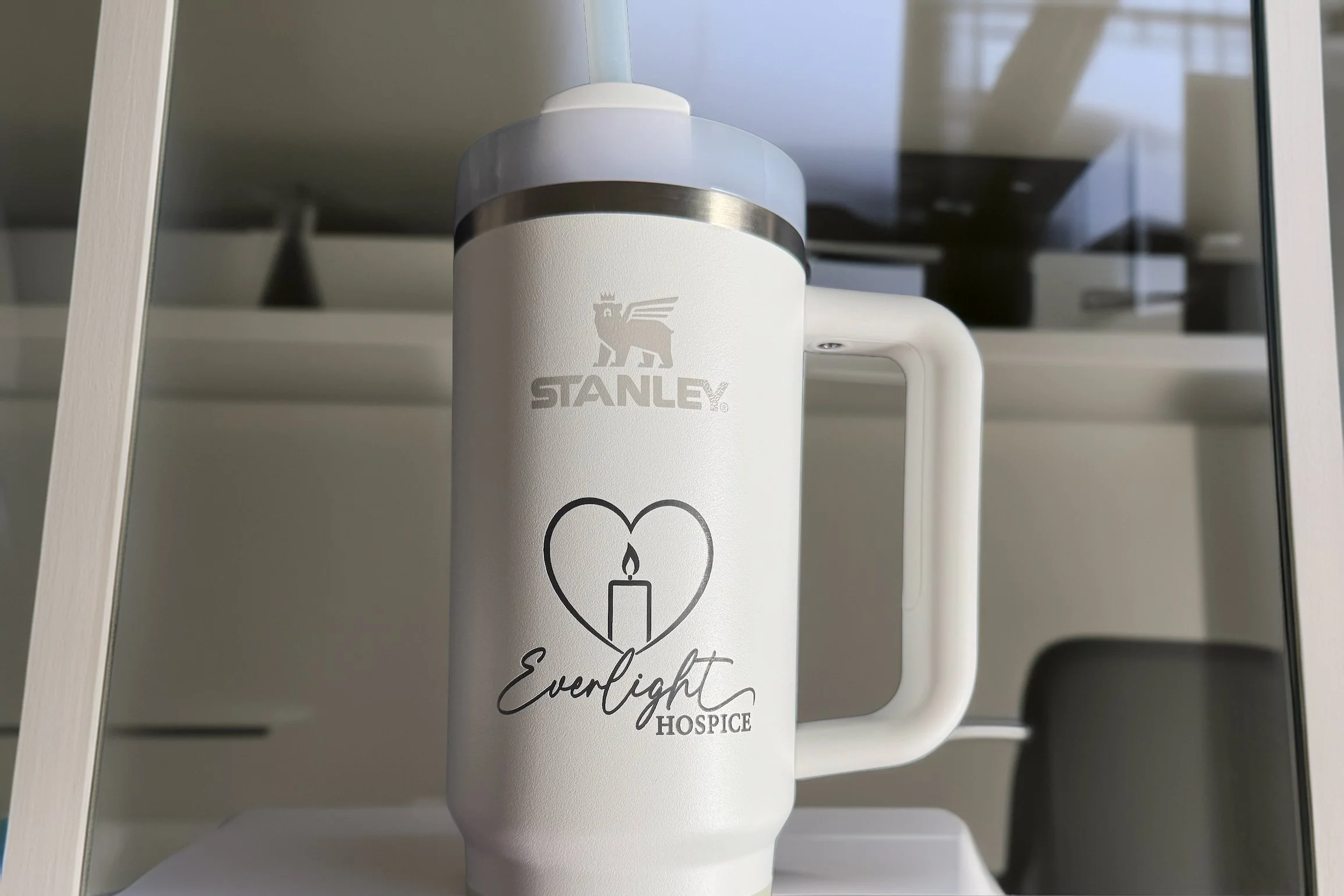 White Stanley tumbler with "Everlight Hospice" logo engraved 