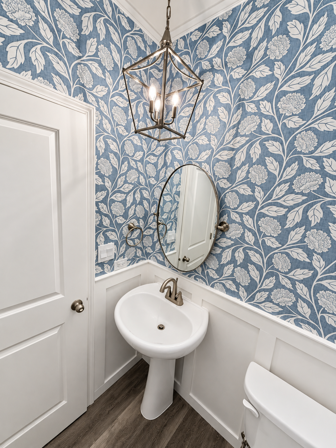 Brightened wallpapered powder room.png