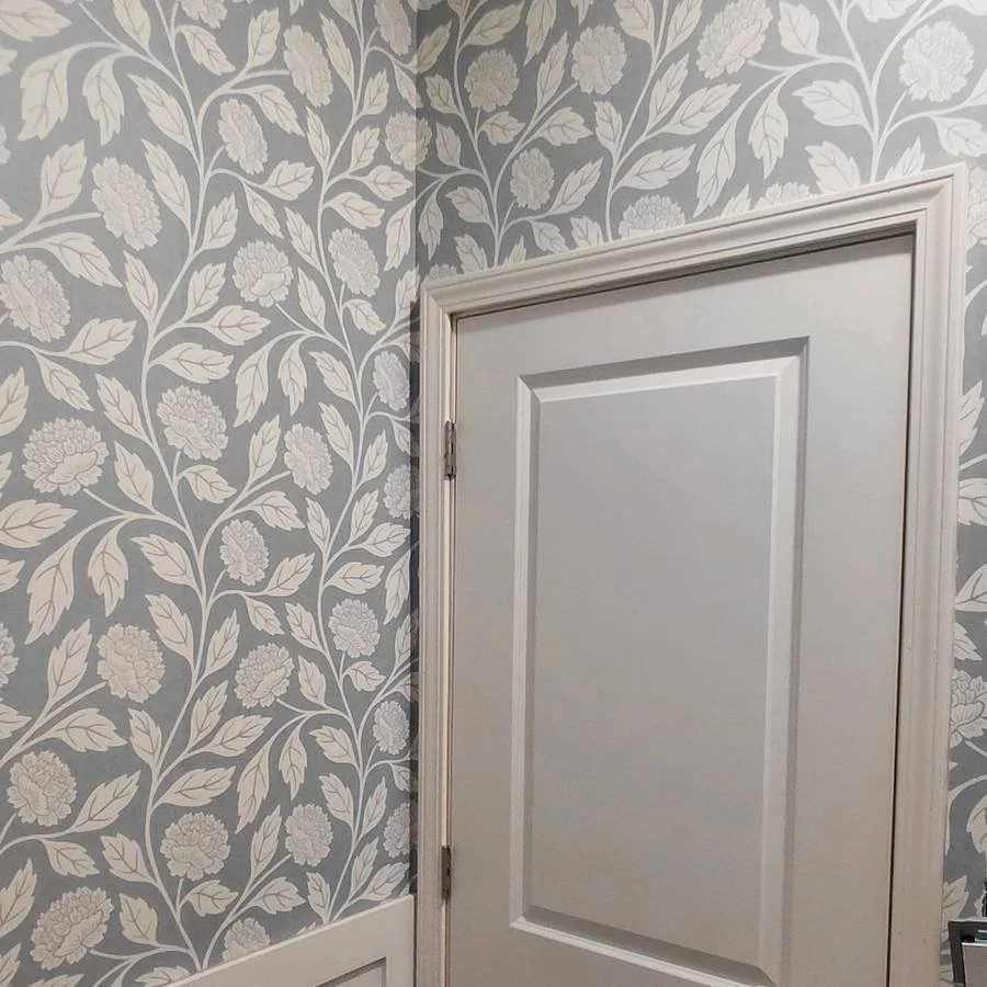 Almost done: wallpaper and wainscoting are installed; final details remain.
