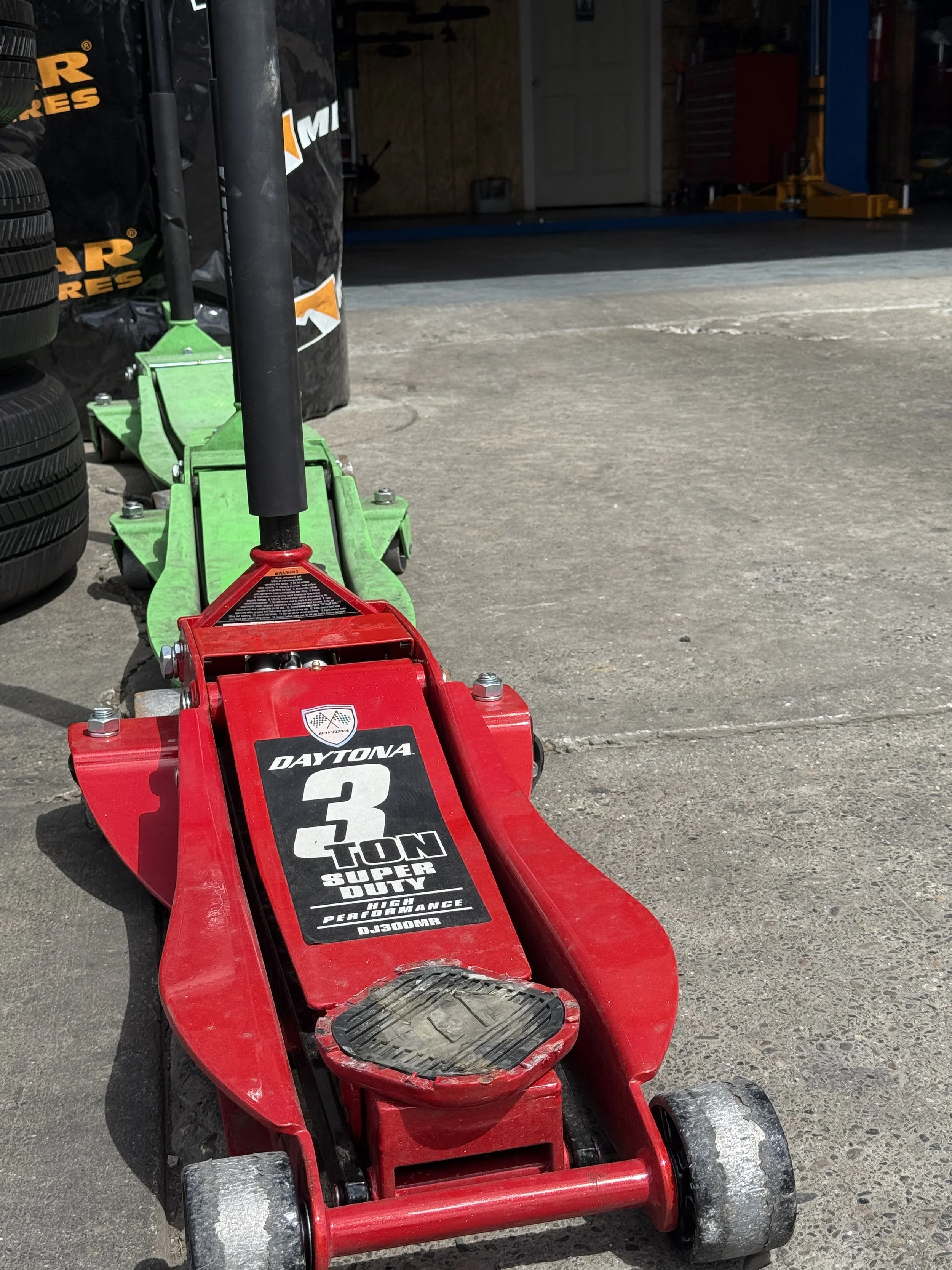 Floor jacks for wheels and tires and services