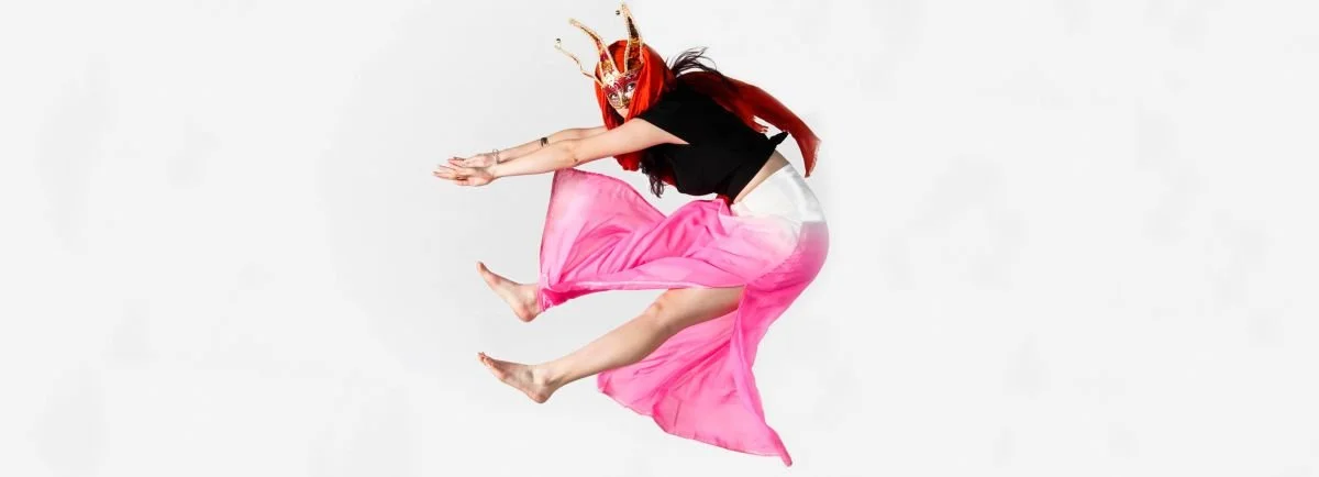 Model jumping in costume.jpg
