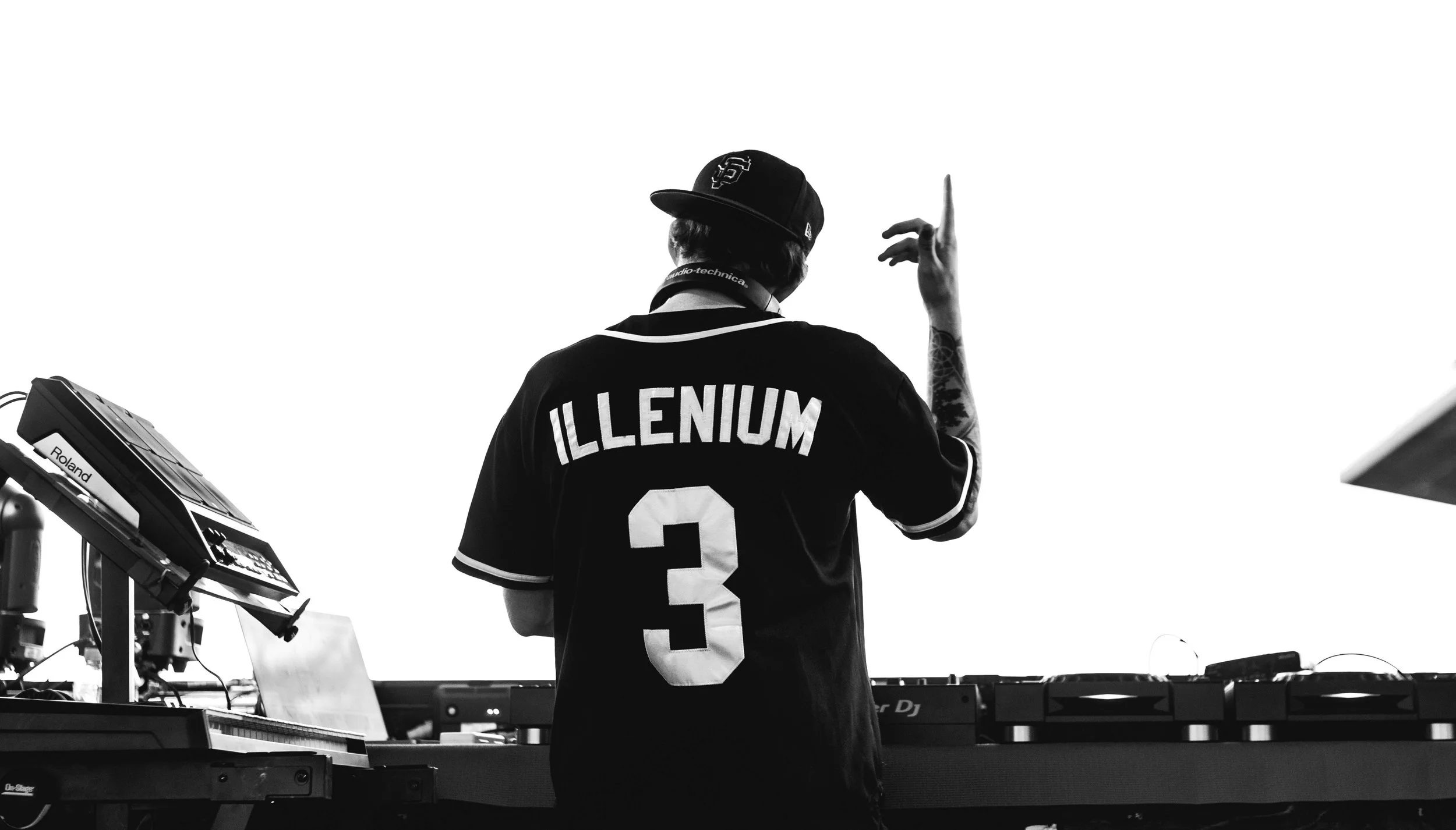Cinematic concert photography of EDM DJ Illenium performing live on the main stage of Summer of Sound music festival in Winnipeg, Manitoba