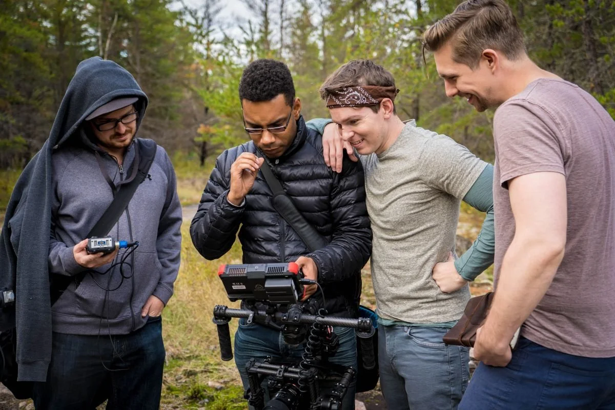A behind-the-scenes behind the camera crew monitoring film footage on an outdoor set in Winnipeg for director Jonathan Lawrence's short film Alter Boys; click to view the film EPK, BTS, and documentary photography gallery.