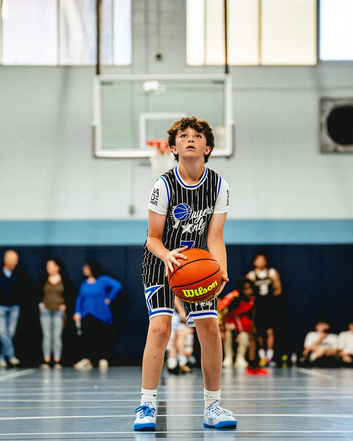 Players Only AAU basketball player competing in game action.