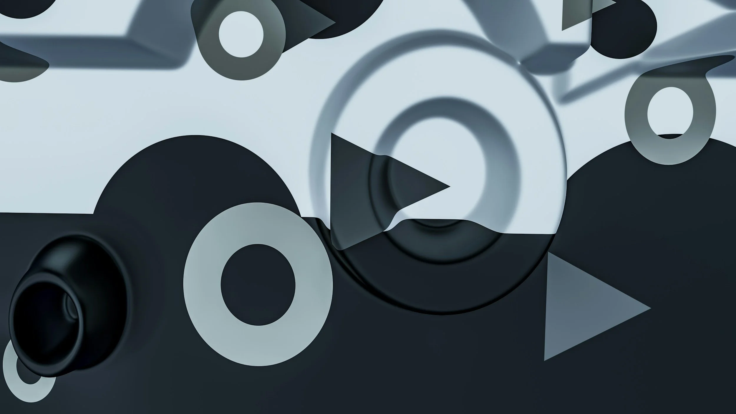 A collection of black and white speaker cones arranged closely together, viewed from above.