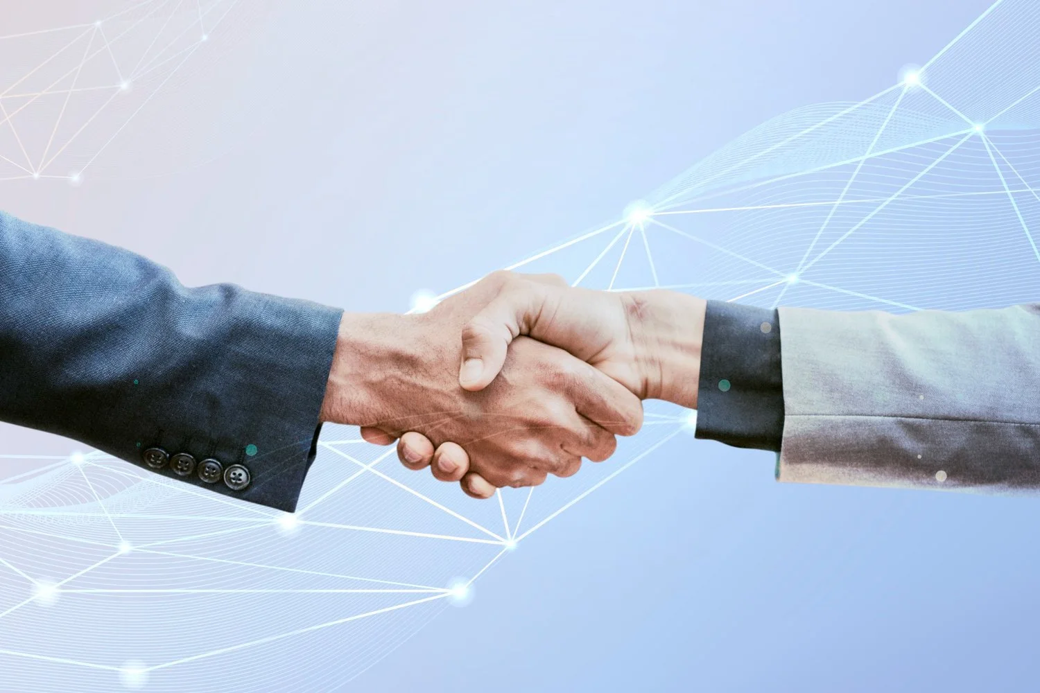 Close-up of two men in suits shaking hands against a light blue background with digital network lines and glowing points.