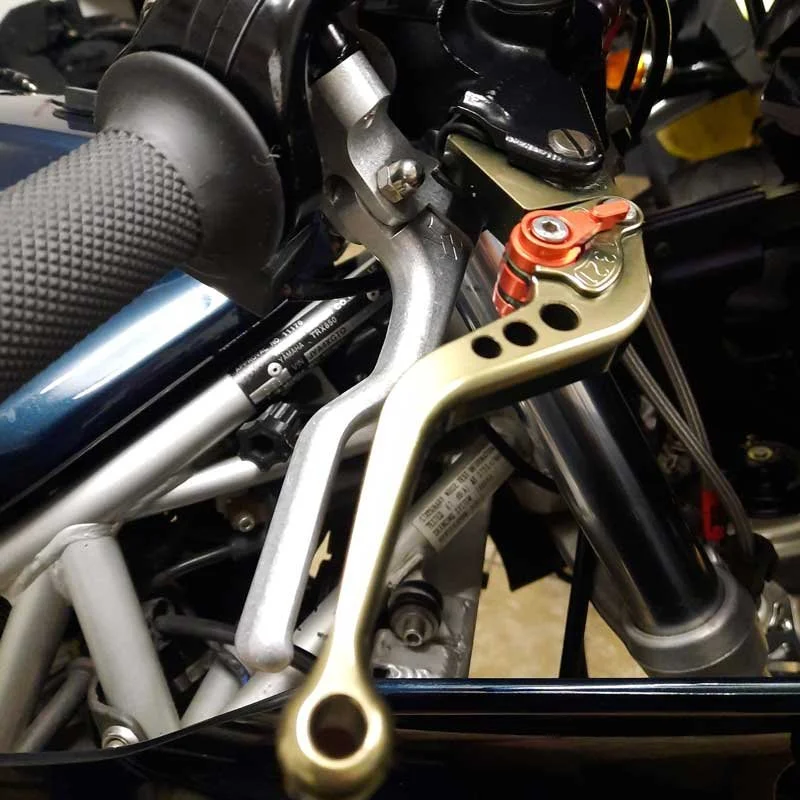 Dual levers - Brake top, clutch below.