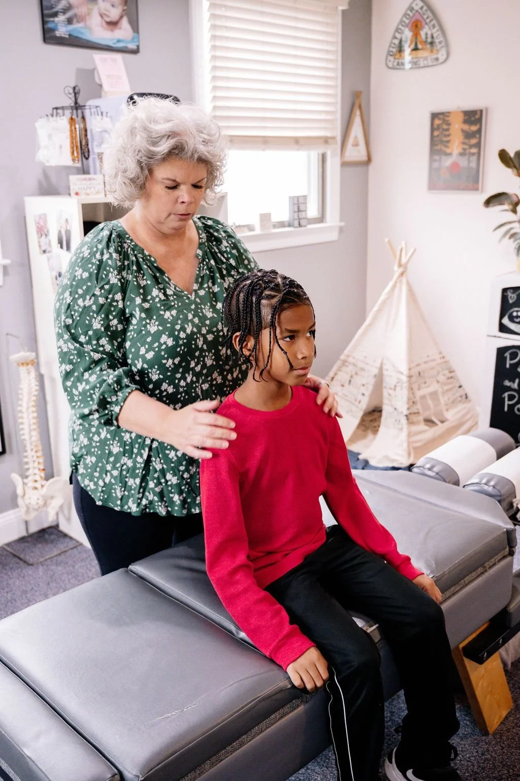 Dr. Brenda Fairchild,  pediatric and family chiropractor performing a gentle adjustment on a child with constipation, adhd, low back pain, knee and ankle pain.  Newark, DE, Middletown, DE, Wilmington, DE Pennsylvania, New Jersey