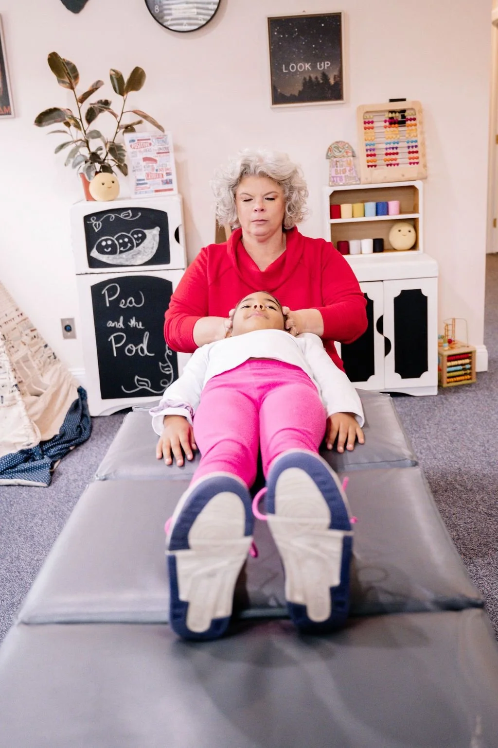 Dr. Brenda Fairchild, pediatric and family chiropractor, performing a light adjustment on a child with diarrhea, headaches, neck pain.  Delaware, Pennsylvania, and New Jersey.