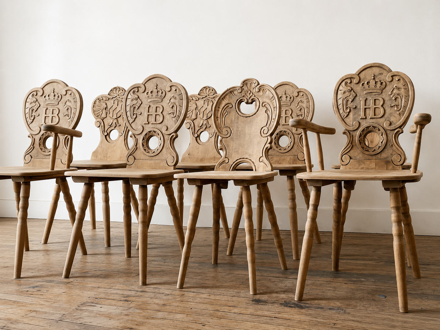 Historic carved Hofbräuhaus chairs from Munich, Germany, restored by Kunicki Restoration.
