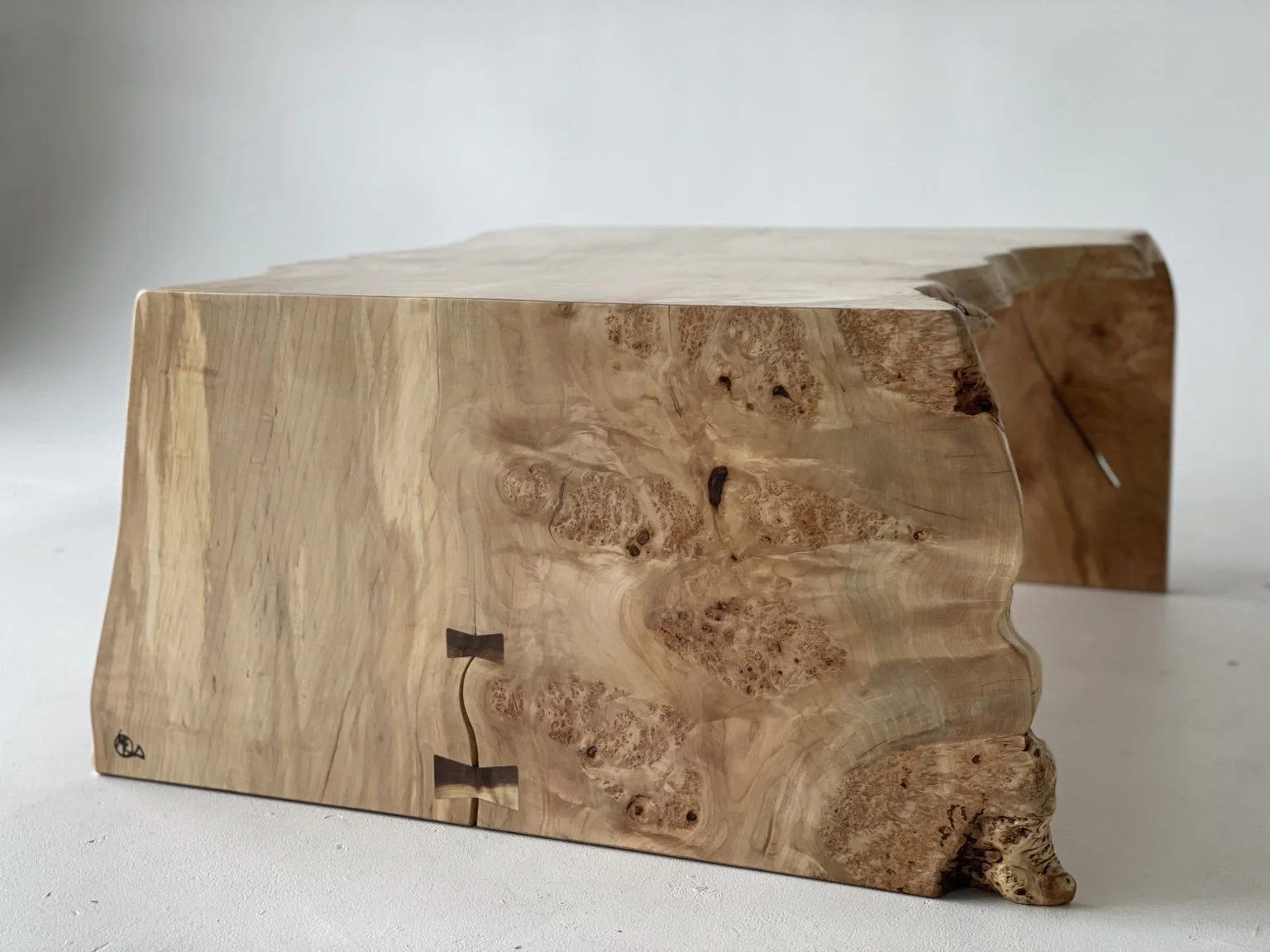 Figured maple waterfall table with walnut butterfly keys, hand-finished by Kunicki Restoration in Denver.