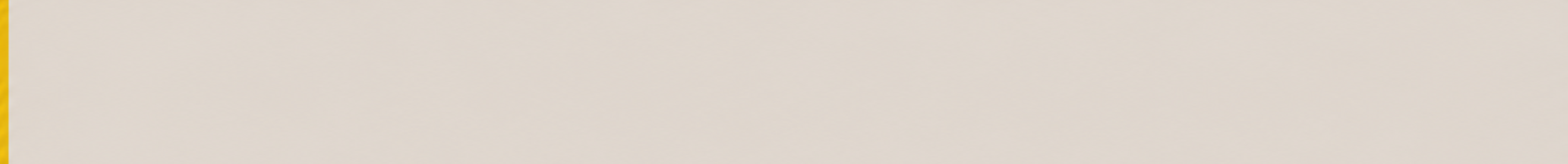 A plain, light gray surface with a yellow vertical stripe on the left edge.
