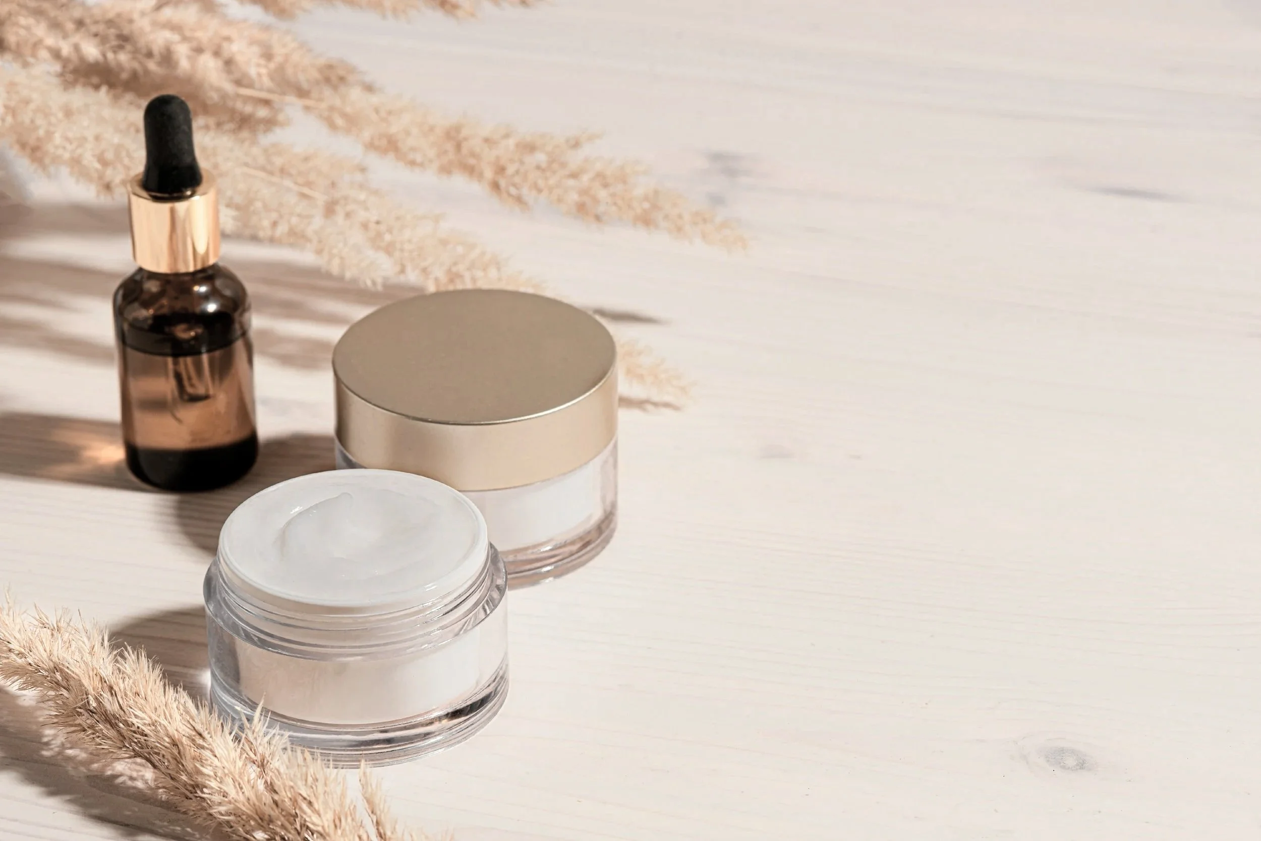 Serum dropper bottle and cream jars, the professional skincare Chrissy recommends after a custom facial