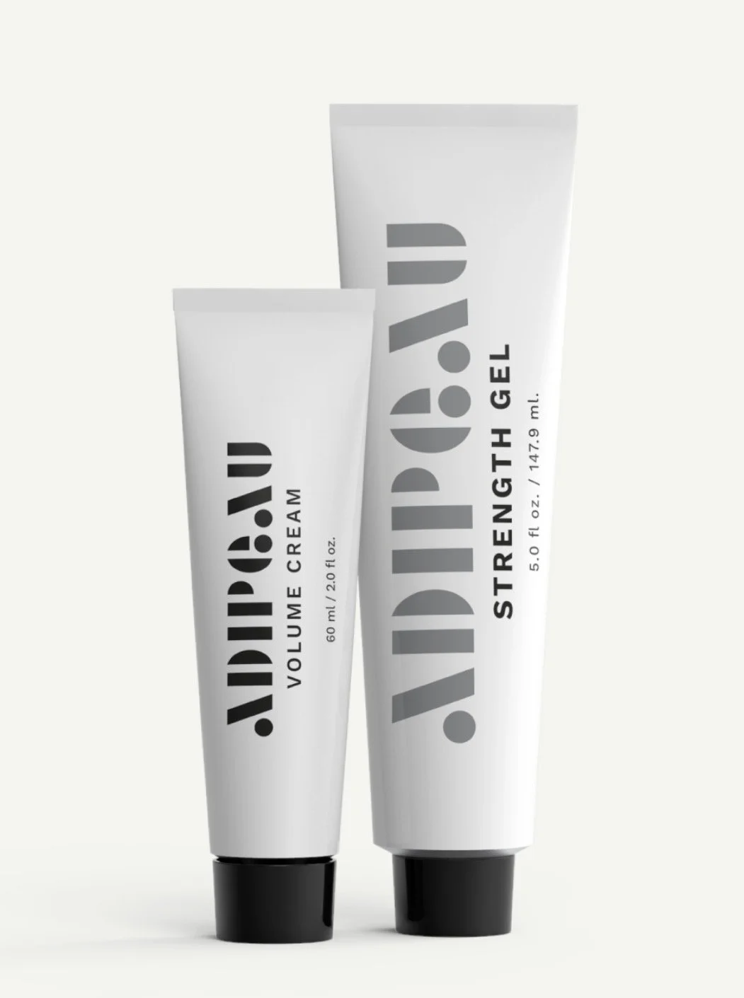 Two tubes of Jacked! hair styling products, one labeled 'Volume Cream' and the other 'Strength Gel'