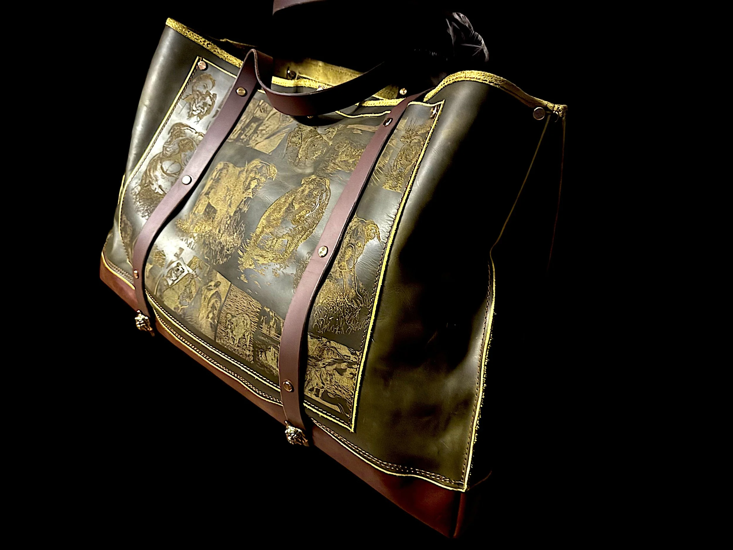 A decorative bag with gold and black artwork featuring lions, elephants, and other scenes, accented with leather straps and gold details.