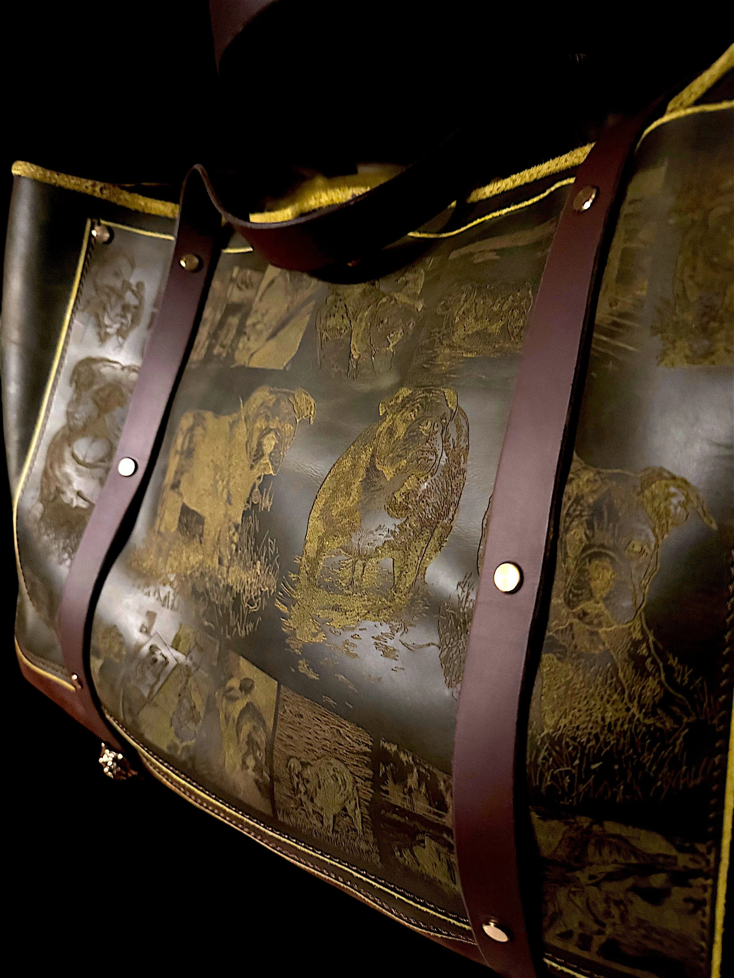 A close-up of a decorative Asian art piece with gold-colored stylized animals and intricate details, encased in a dark frame with bolts.