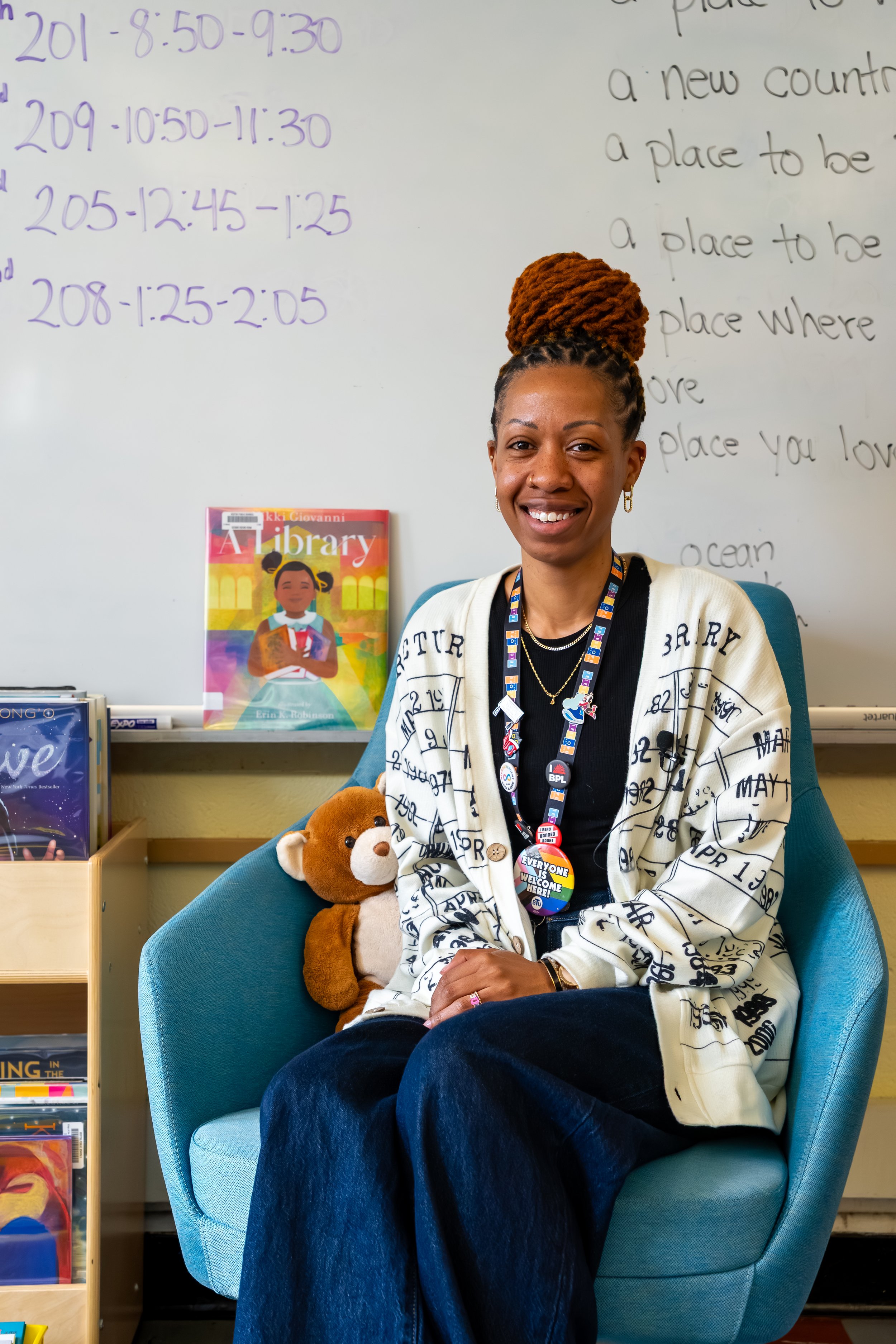 Boston Public Schools librarian Kadian Simmonds poses for a photo at the Chittick Elementary School library.