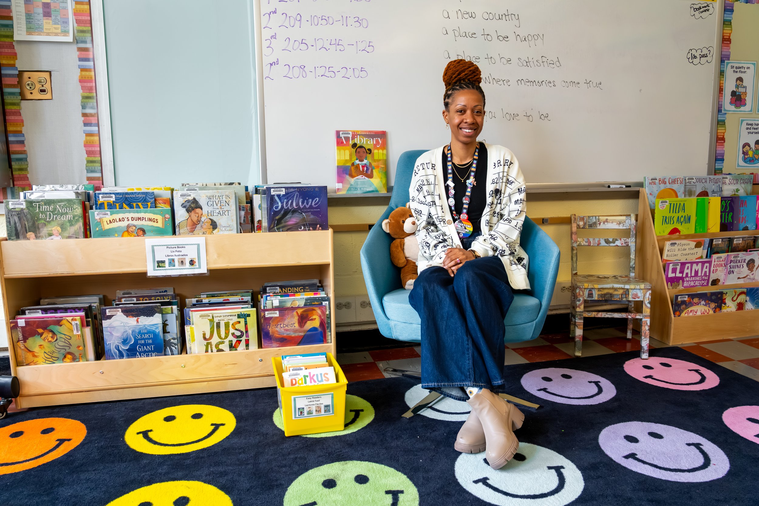 Boston Public Schools librarian Kadian Simmonds poses for a photo at the Chittick Elementary School library.