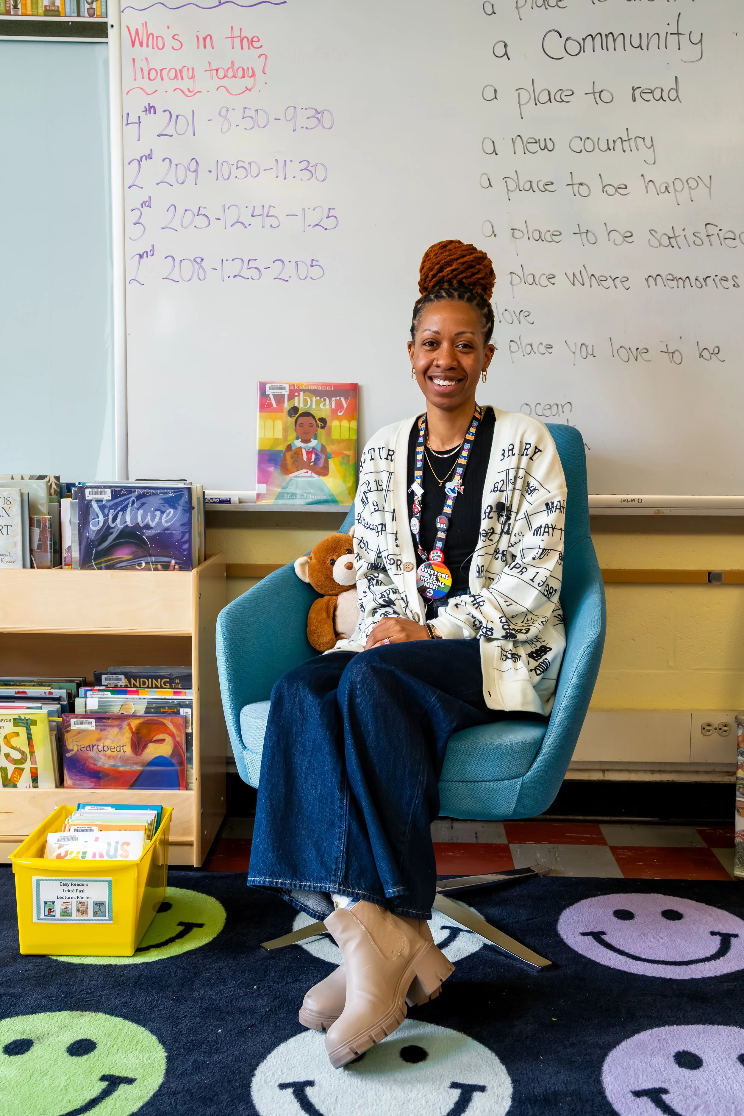 Boston Public Schools librarian Kadian Simmonds poses for a photo at the Chittick Elementary School library.