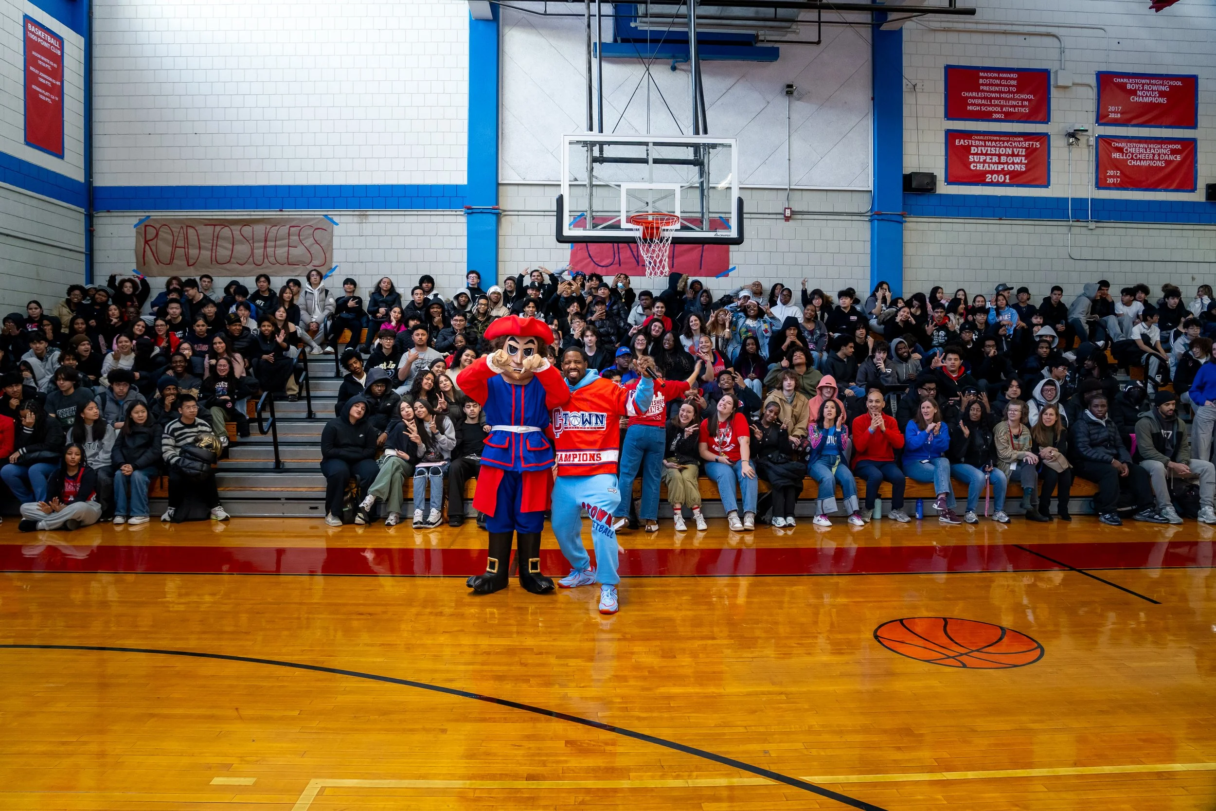 A large group of Charlestown High School students and staff pose for a photo.