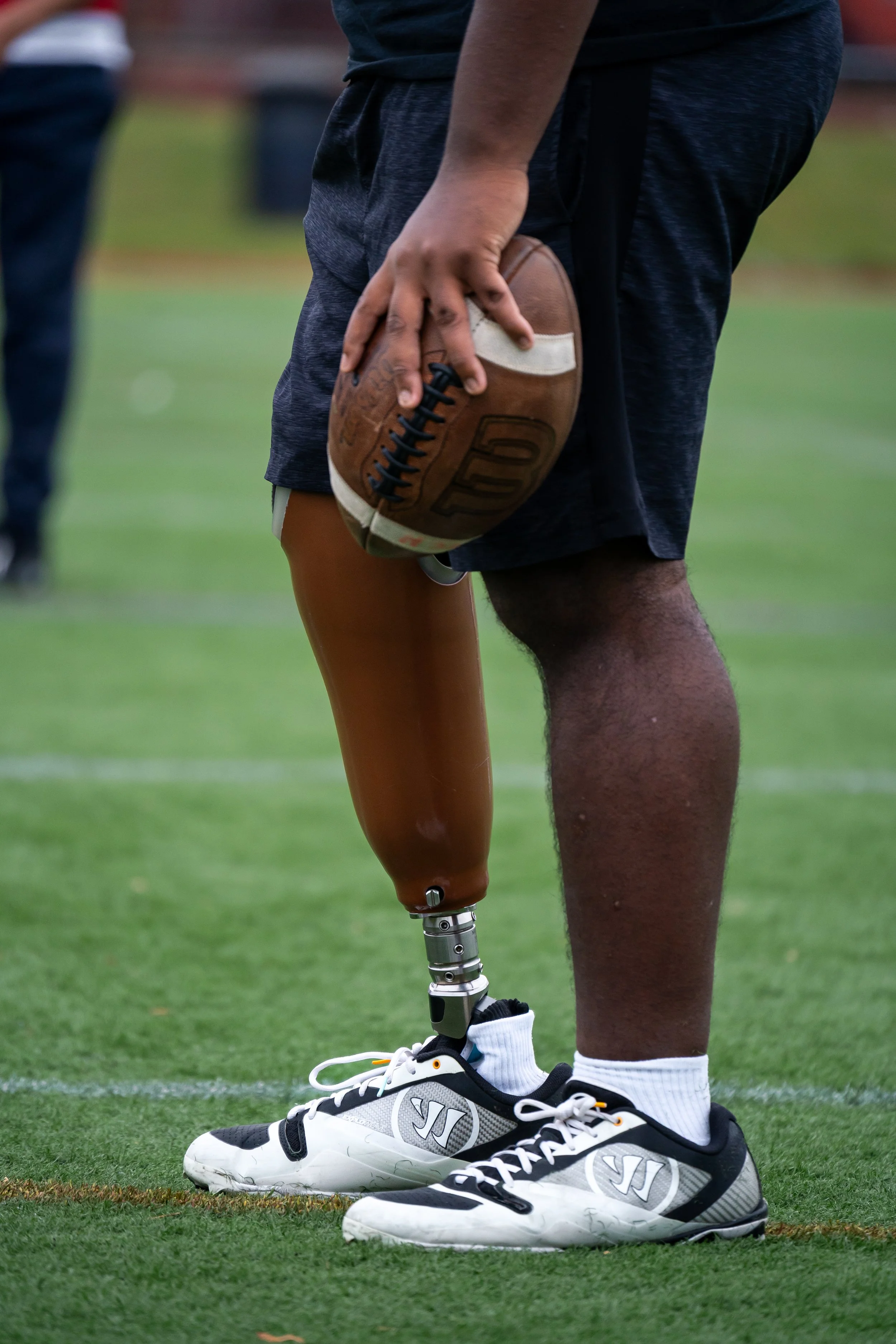 A close shot of Boston Public Schools football player Edgar Santana Castro's prosthetic leg.