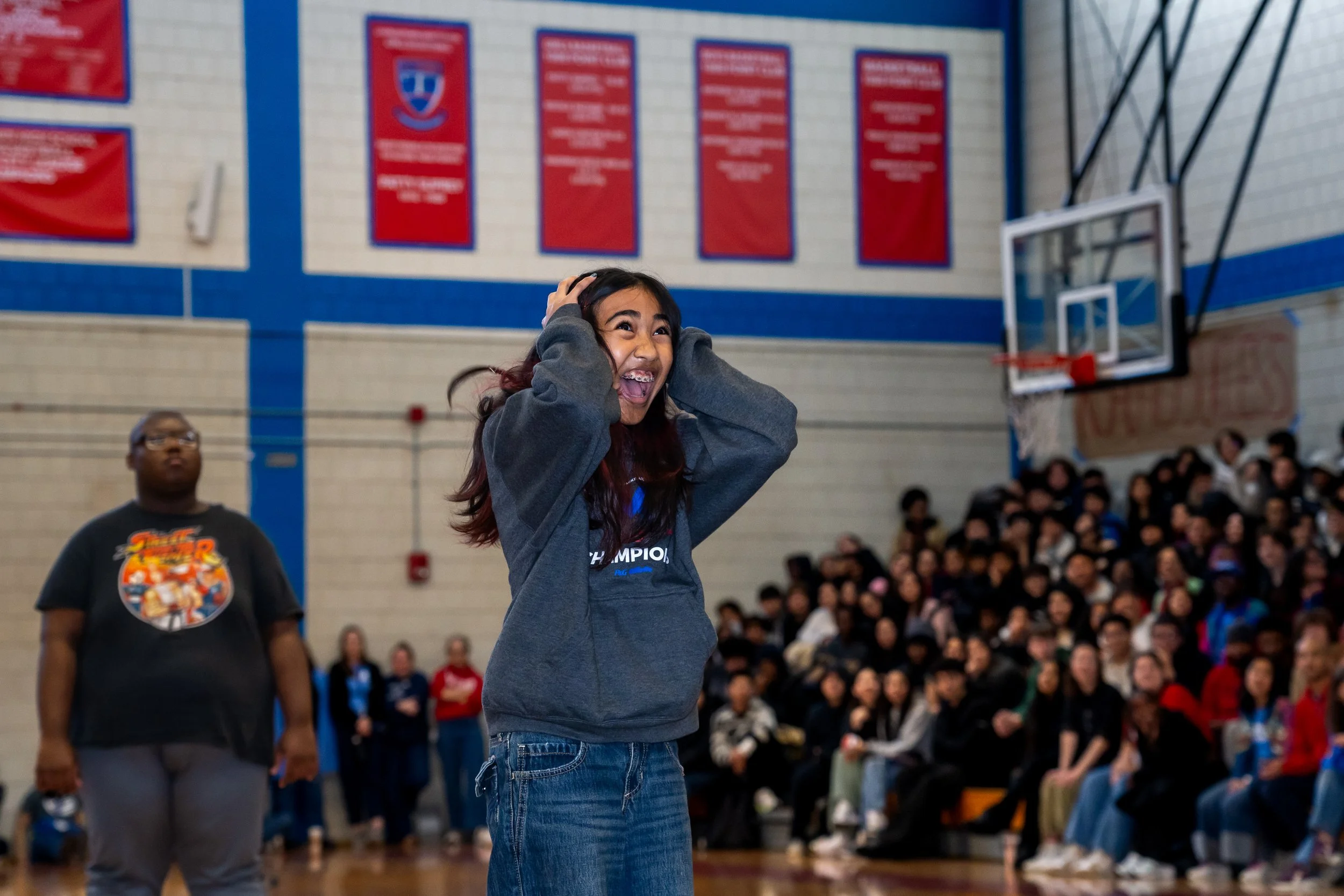 Charlestown High School student exclaims after she shoots a basketball.