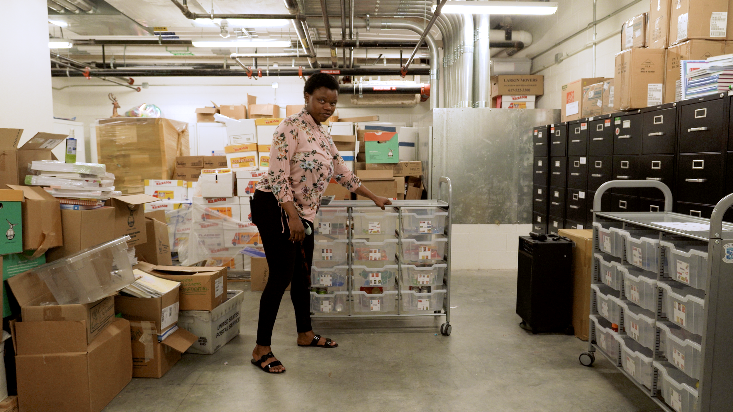 Former Boston Public Schools student Ophelia Hughes shows her snack cart.