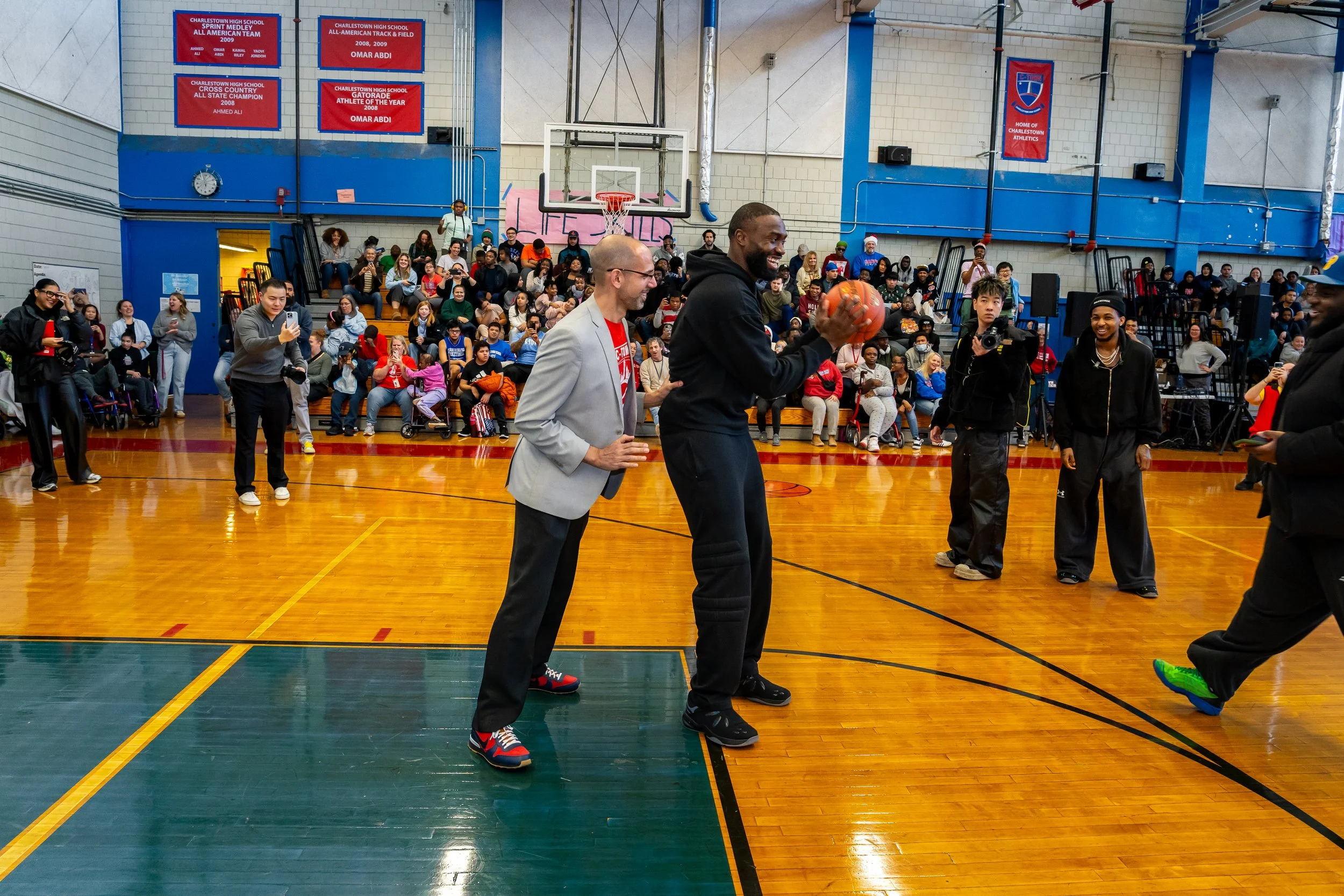 NBA Star and former Boston Celtics and current Philadelphia 76ers basketball player Jaylen Brown plays basketball against the Charlestown High School school leader.