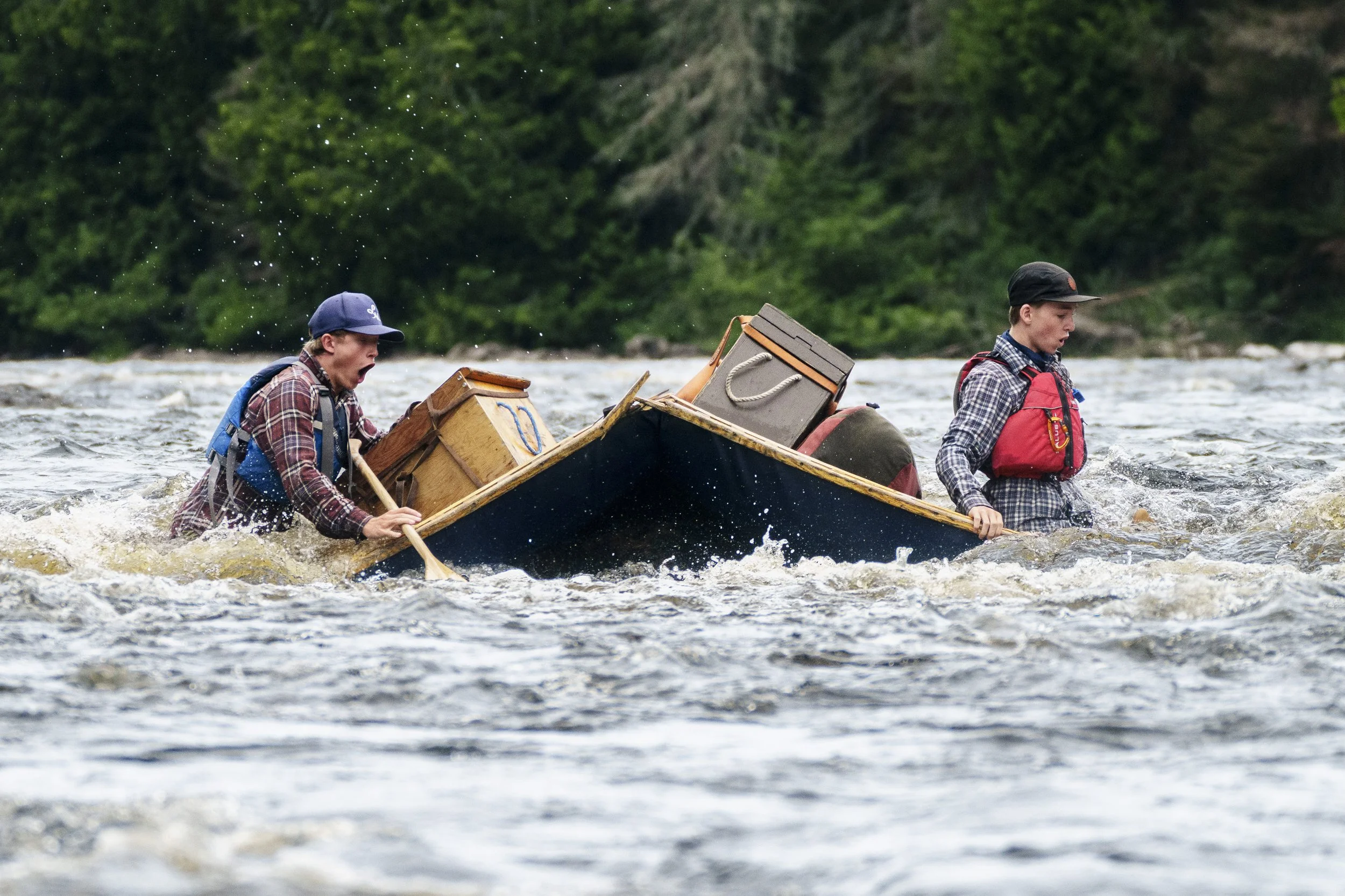 Peter Gant, and Noah Doran-Veevers hit a rock broadside resulting in the splitting and partial wrapping of their cedar canvas canoe while paddling the Dumoine River in southern Quebec on July 15, 2026