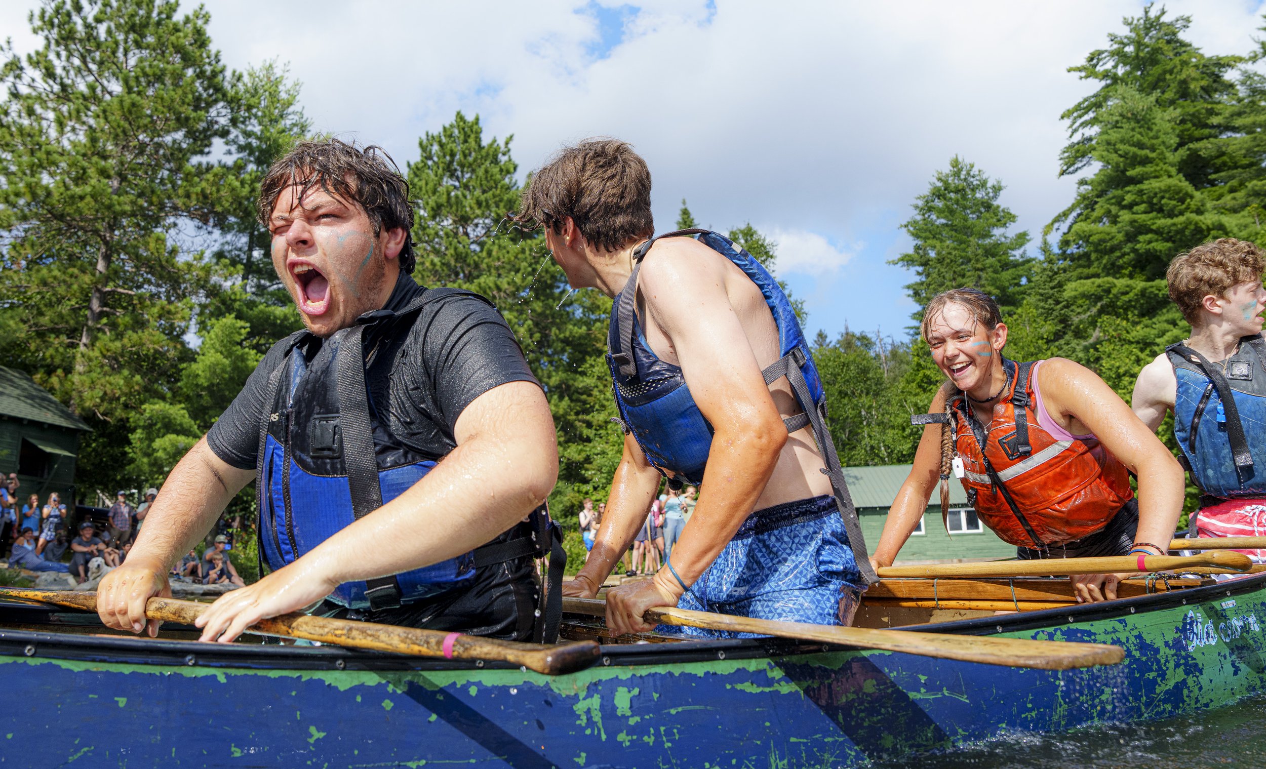 Members of a trip paddling down the Missinaibi river celebrate after winning a canoe tug of war contest during the Camp Olympic Games hosted by Camp Temagami at the conclusion of a summer of wilderness canoe trips on August 8, 2026