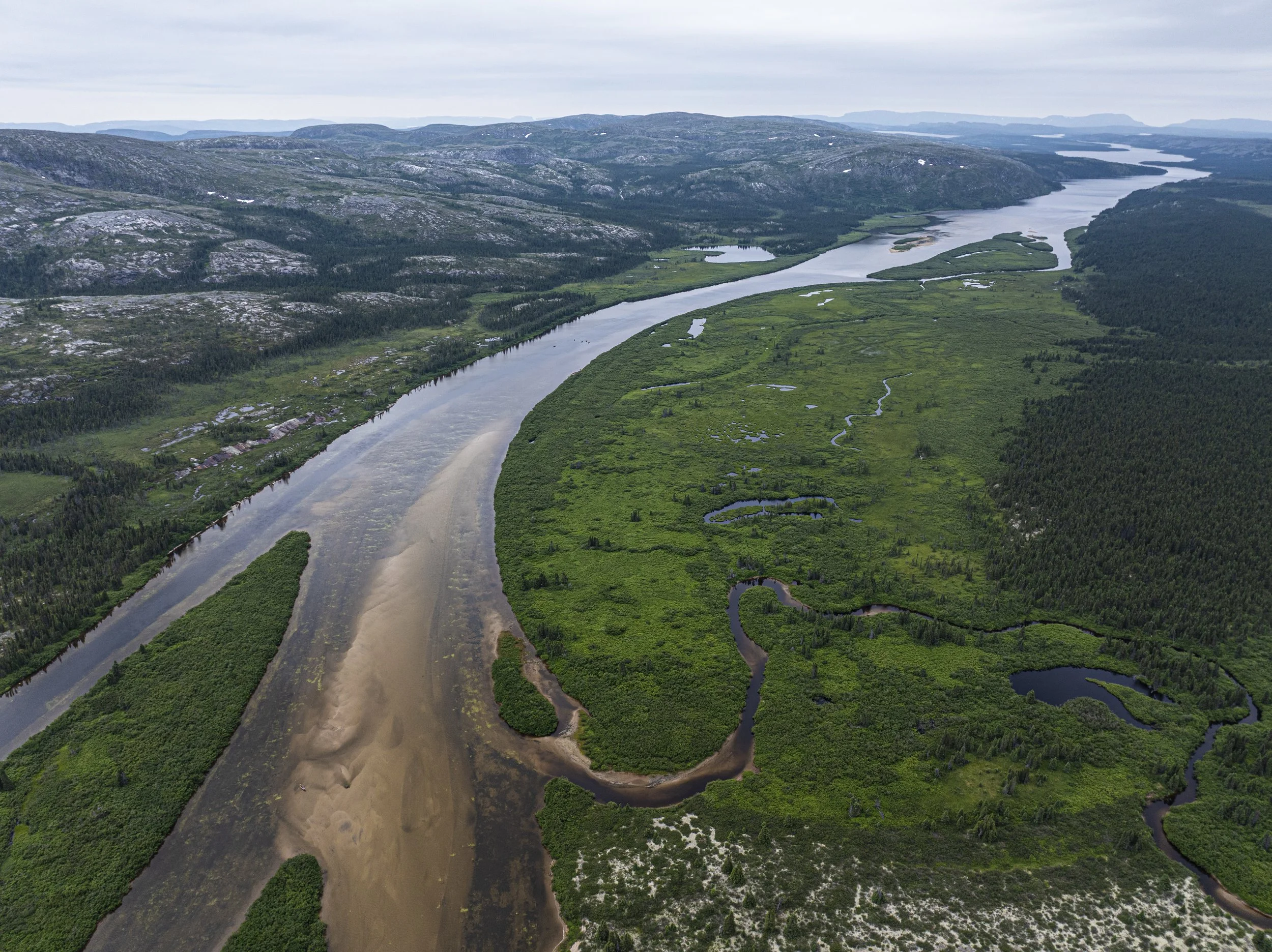 Six canoes travel down the final stretch of the DuNord River on Aug. 2, 2025, following a 45-day, 700-kilometer expedition through the Canadian wilderness. Members of the expedition included Erica Wilson, Duncan Grant, Miles Gordon, Nils Missillier, 