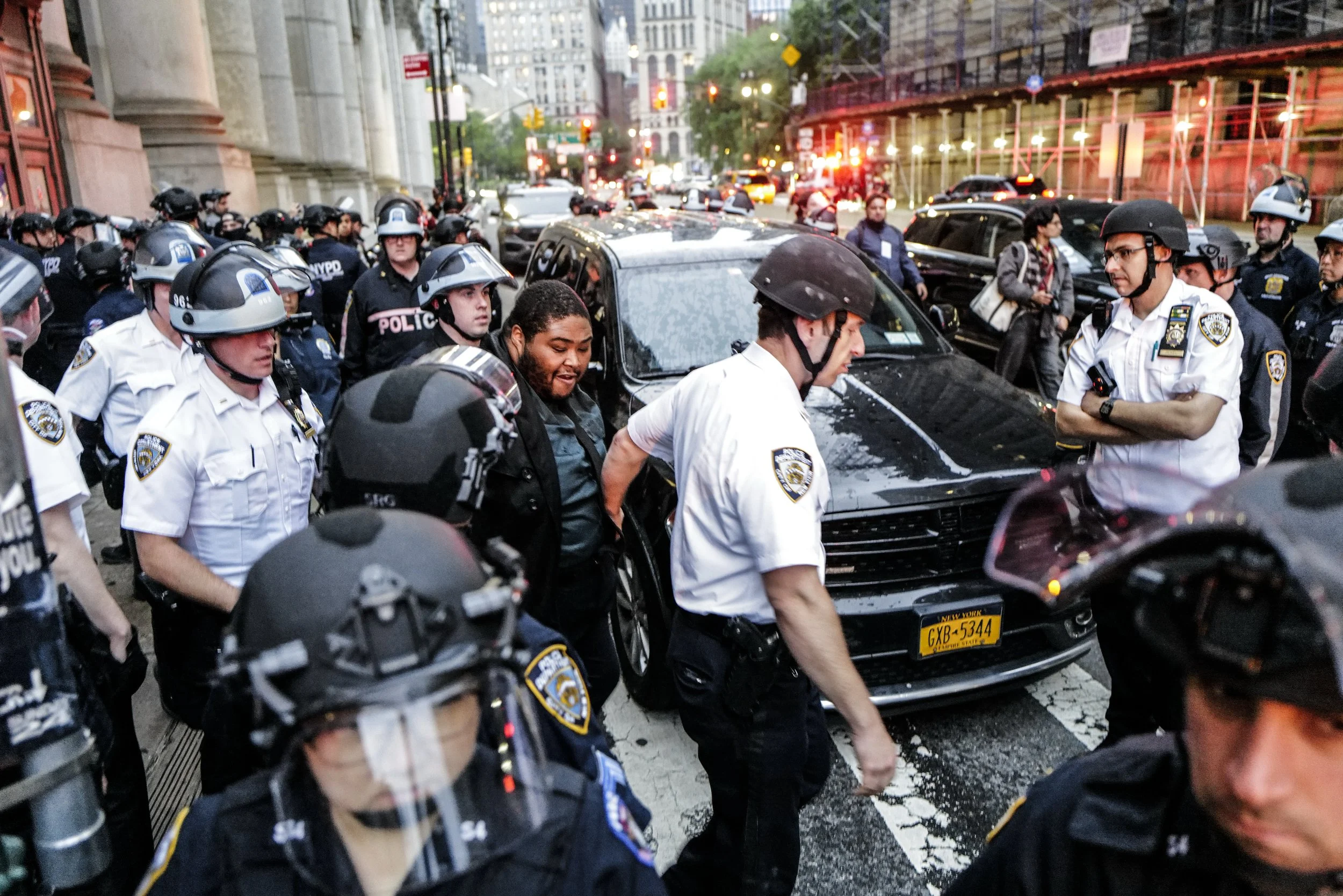 An anonymous man is arrested after a member  of an Anti-Ice protest accused him of threatening him with a knife, Foley Square, New York City, June 14, 2025