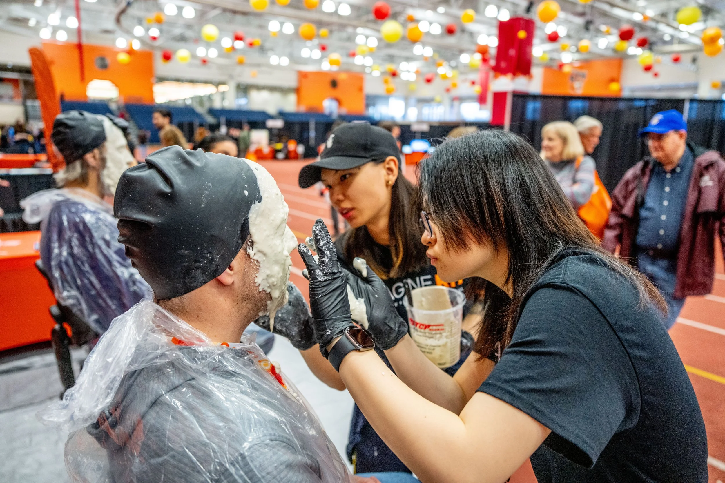 Students from the college of Art and Design make a silicone mold of a visitor's face at Imagine RIT, a community event hosted by the university, April 25, 2026