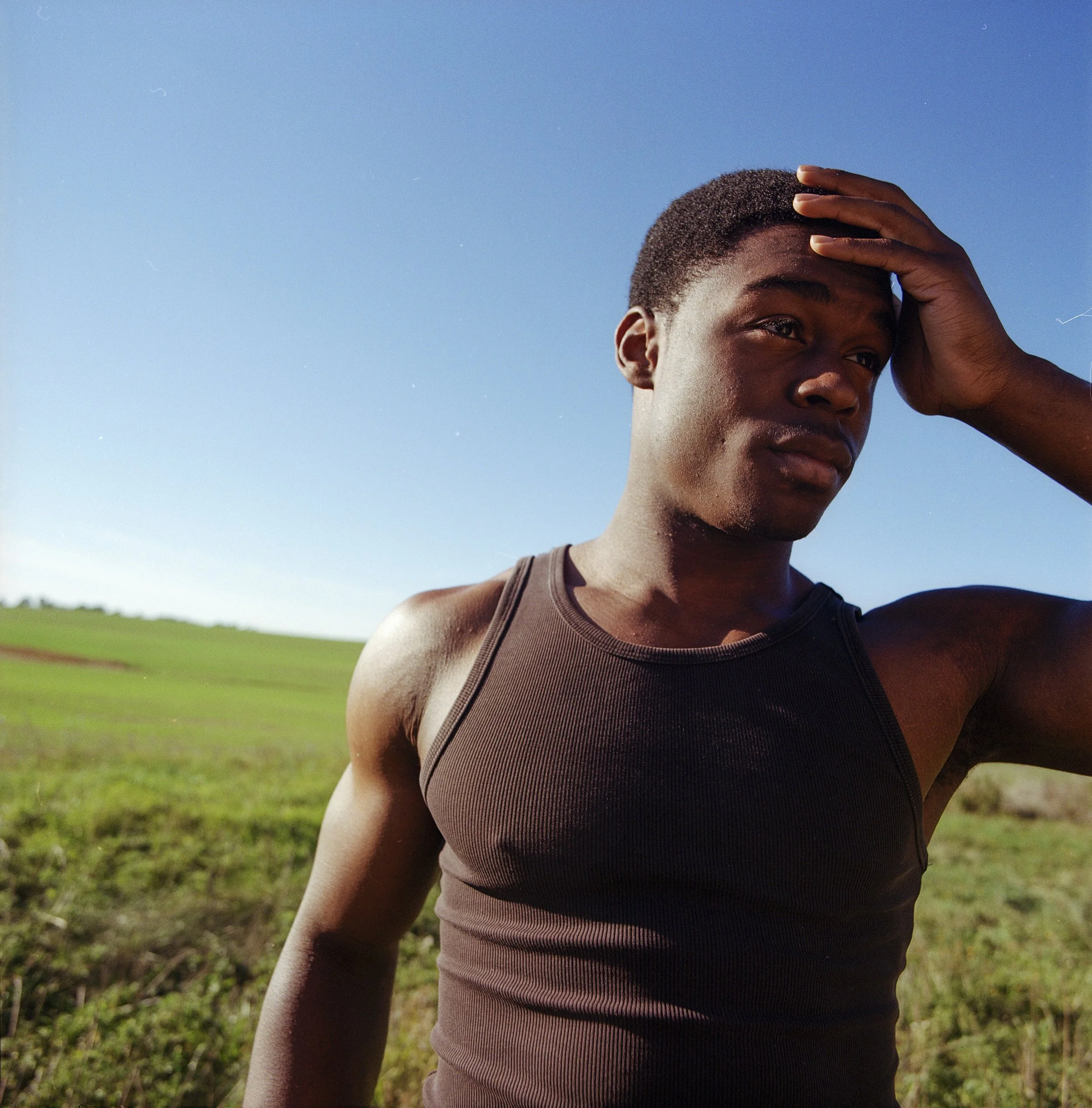Rino Whoba poses for a portrait in a field in Henrietta, New York.