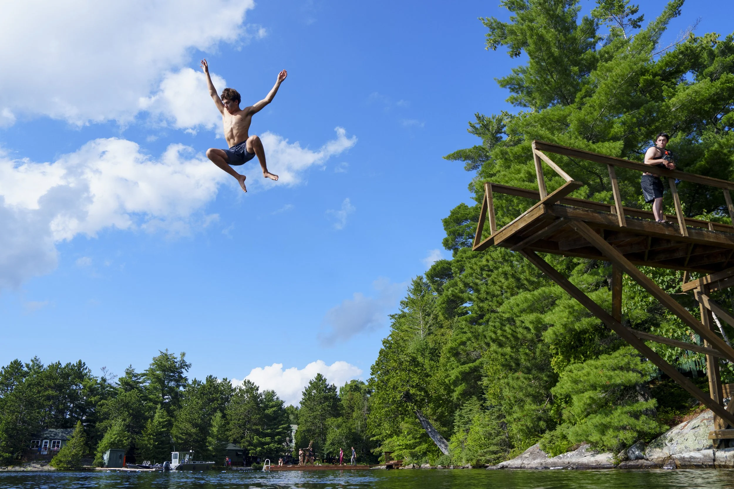 a camper leaps off the jump tower on island 583 of lake Temagami, where Camp Temagami bases its wilderness canoe trips from, August 8, 2026