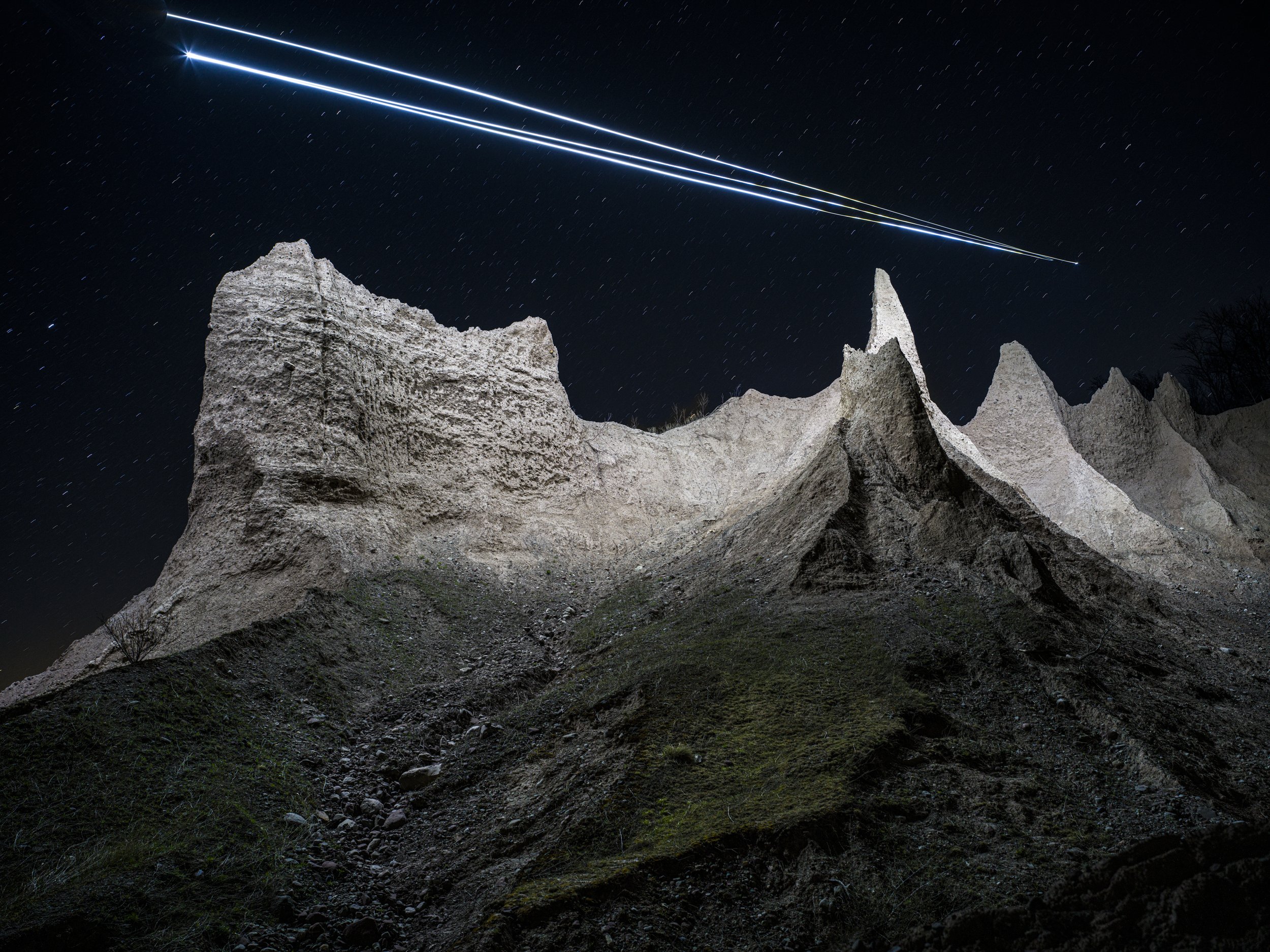 Chimney Bluffs is illuminated by a drone-mounted light in a photograph taken April 22, 2025, in Wolcott, New York.