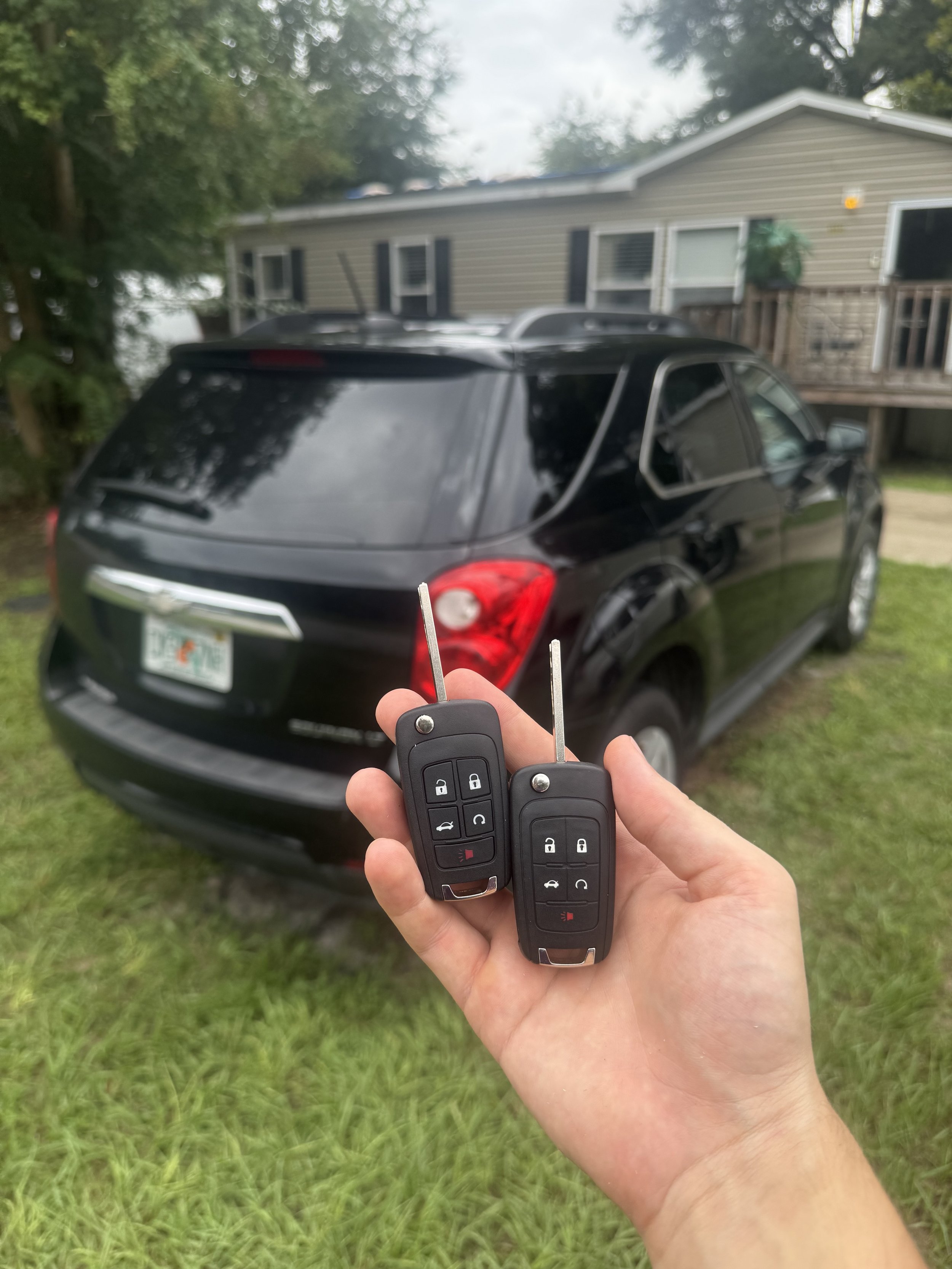 Azov Locksmith programming a smart key for Chevy Equinox