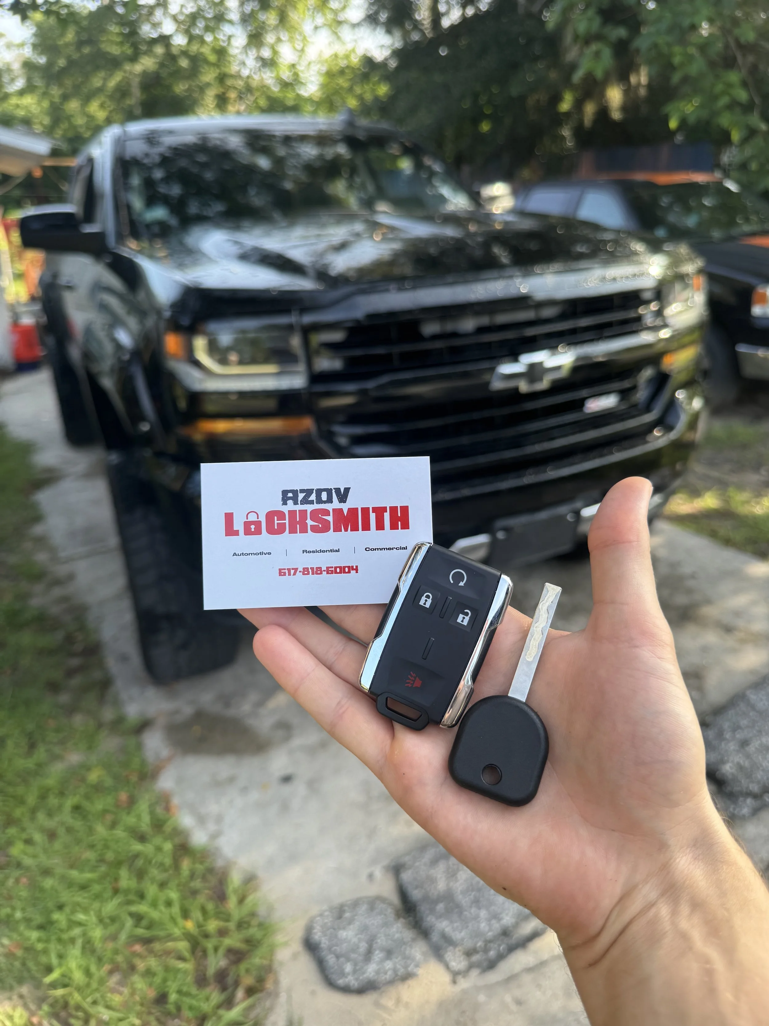 Azov Locksmith programming a key and remote for Chevy Silverado