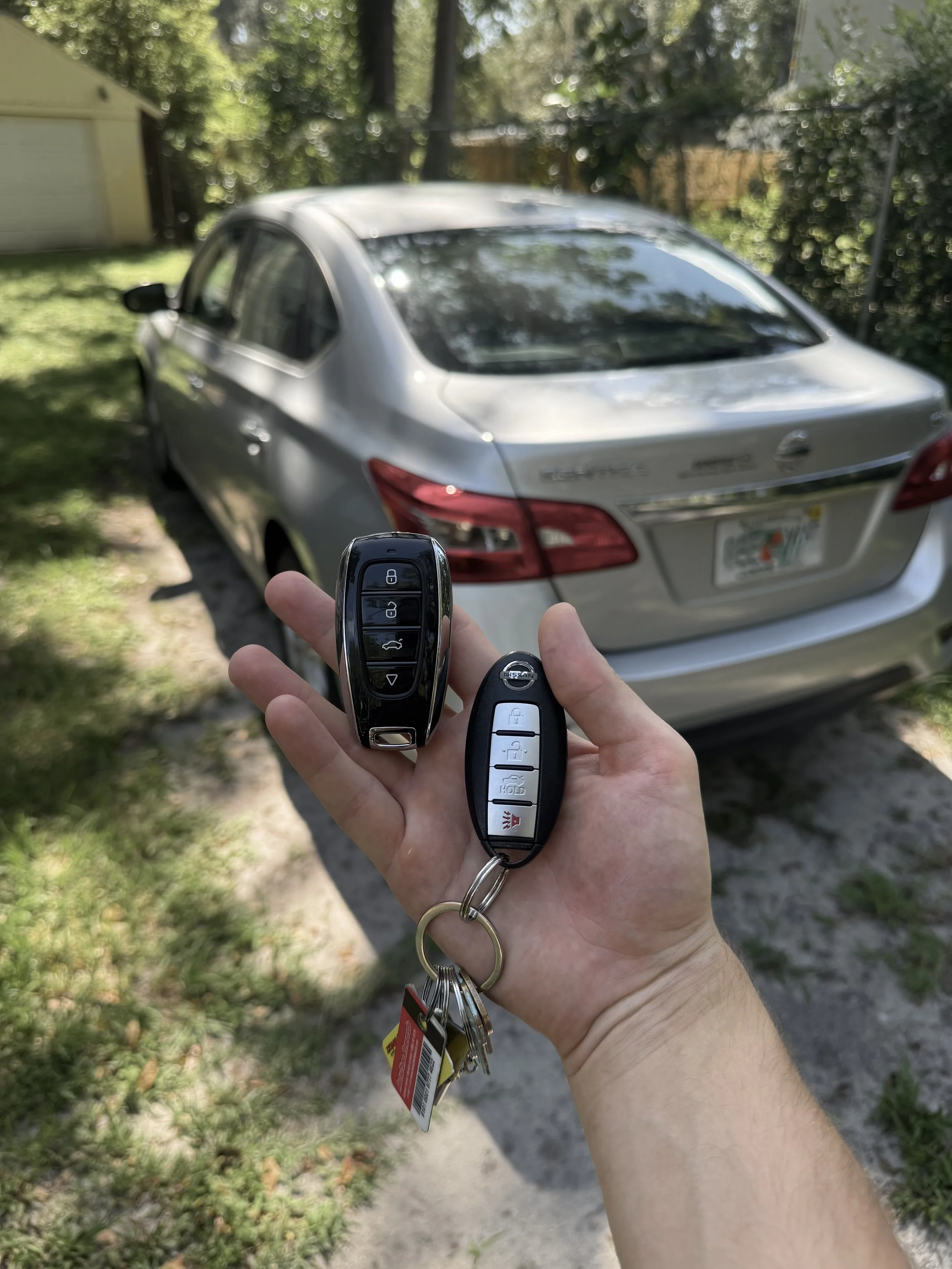 Azov Locksmith programming a key and remote for Nissan Altima and Sentra.