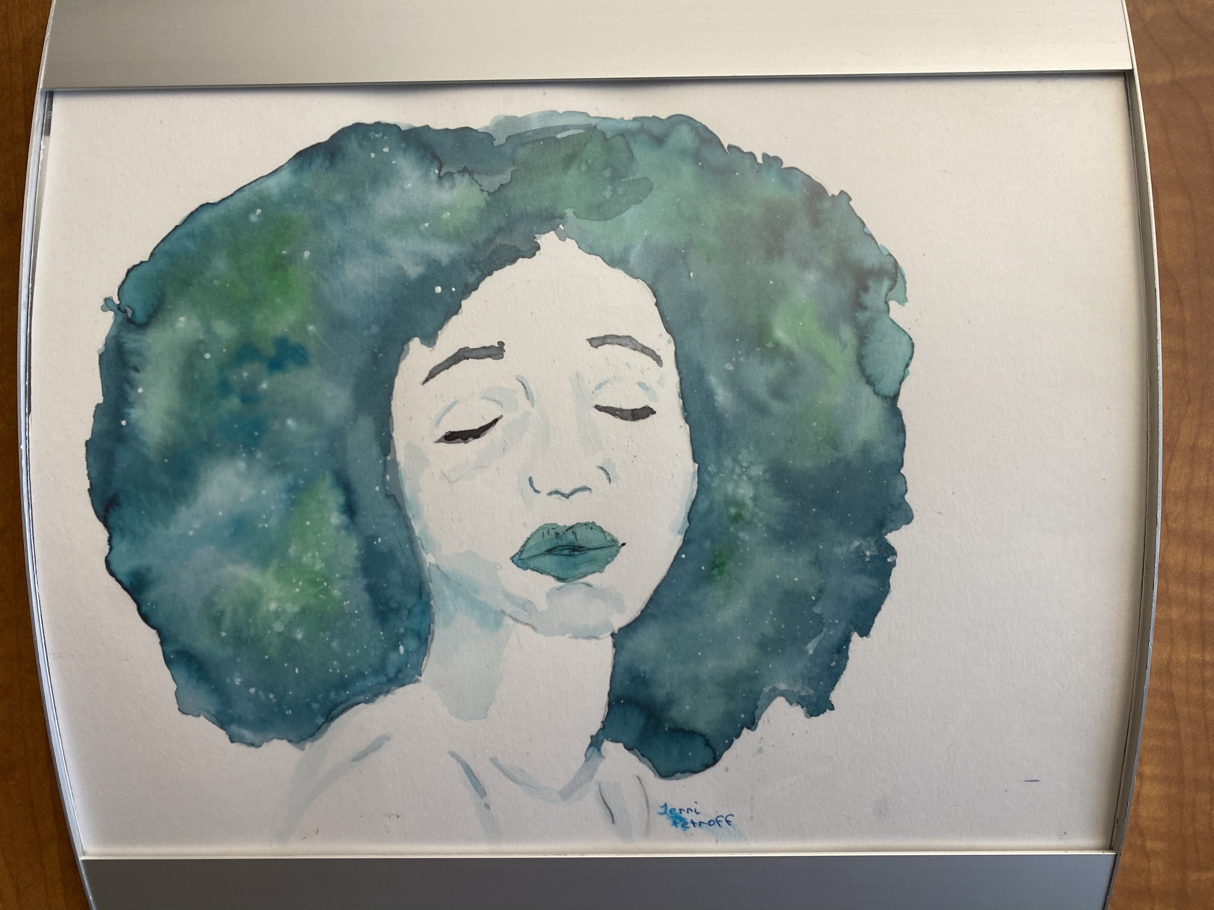 Watercolor painting of a woman's face with closed eyes and medium-length curly hair, signed by Jerri Petroff.