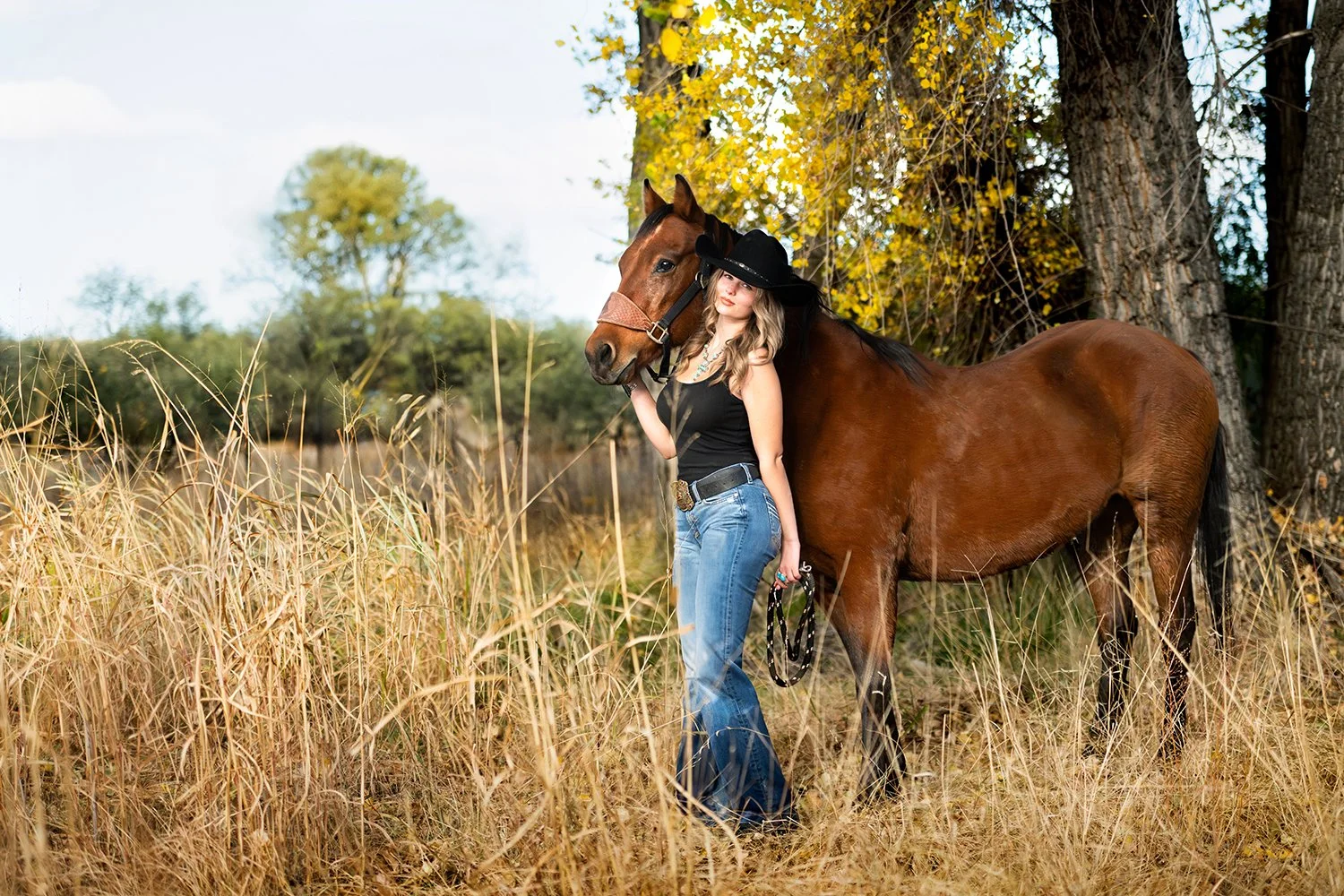TUCSON high school SENIOR POSING FOR PHOTO SHOOT WITH HER HORSE